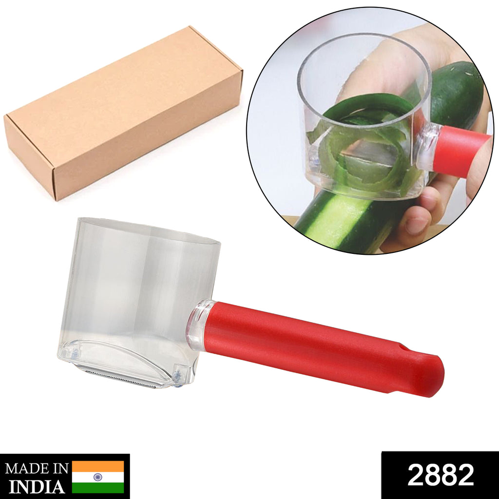 Stainless steel home kitchen fruit vegetable peeler with container, peeling a fresh carrot.