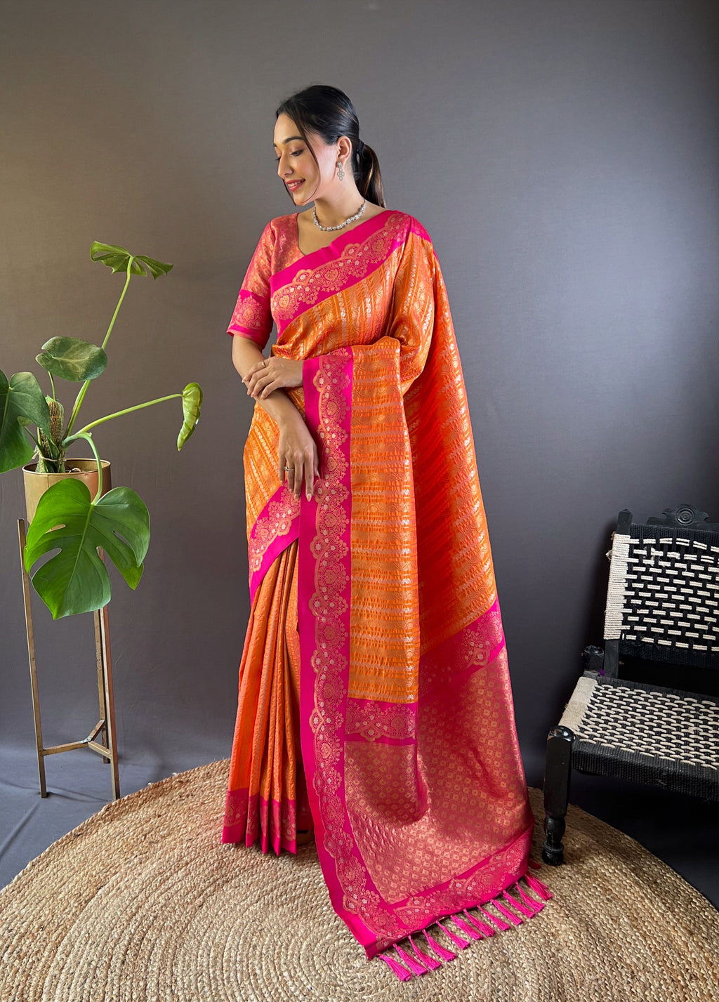 Vibrant Kesari soft silk zari woven partywear saree with shimmering gold details