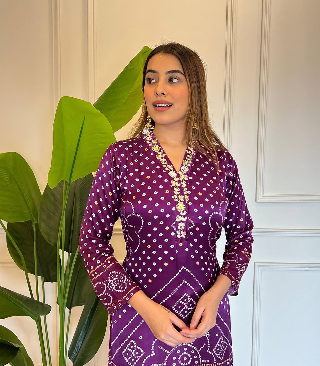Close-up of the model wearing the TRENDBUY purple Bandhani kurti, focusing on the embroidered neckline and sleeve details.