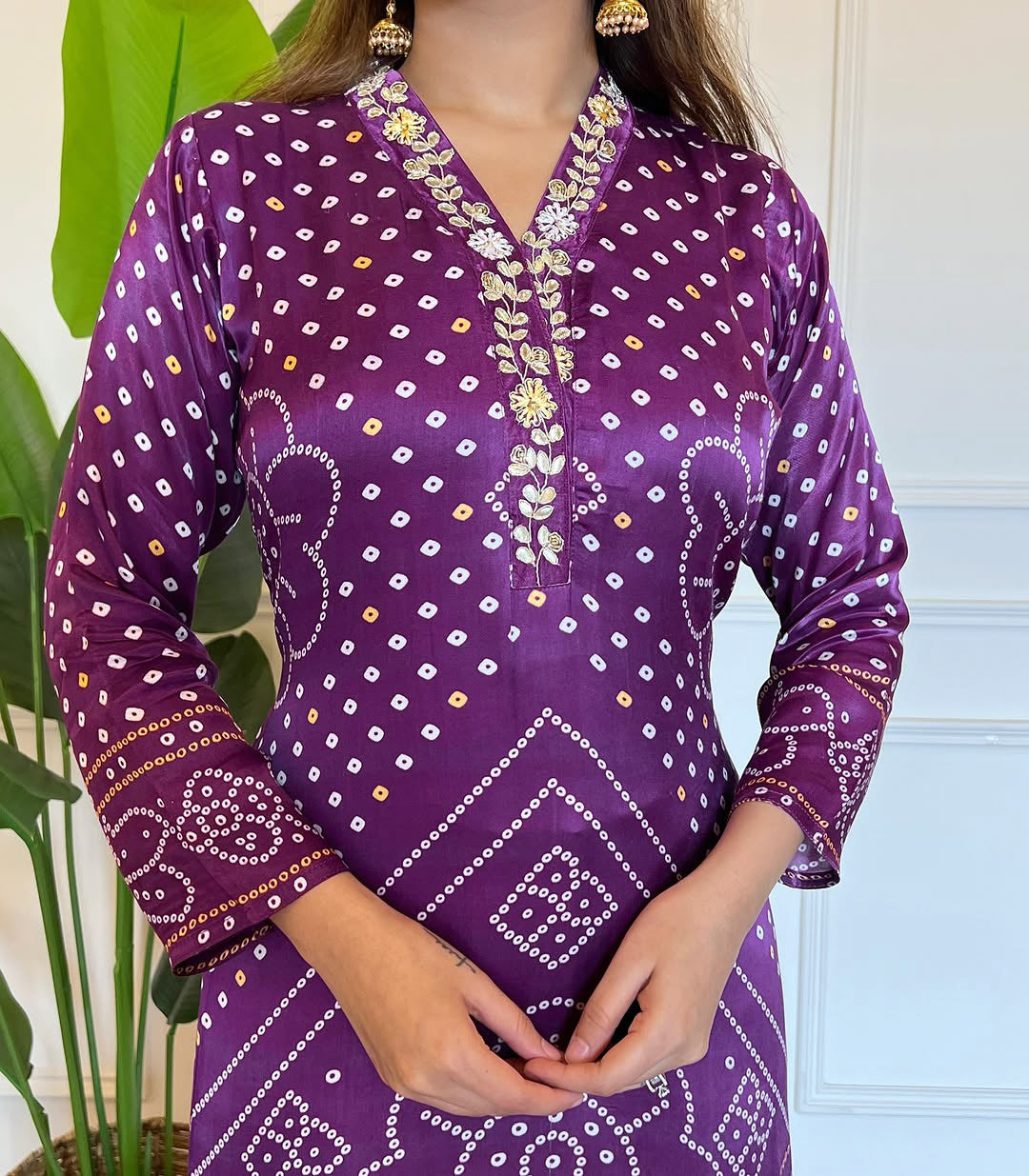 Detailed shot of the embroidered V-neck and unique Bandhani-inspired print on the purple viscose kurti from TRENDBUY.