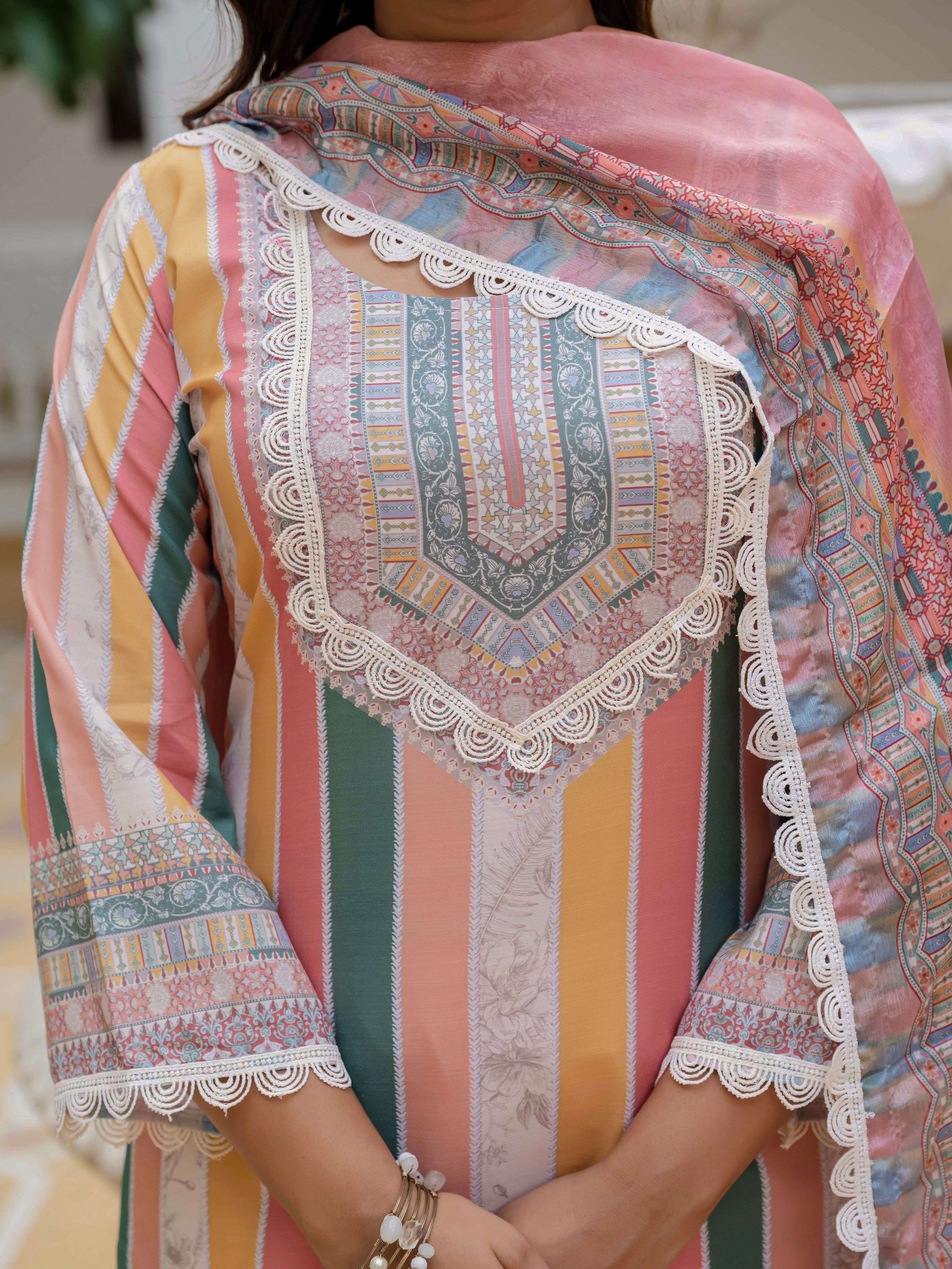 Close-up of Laila Orange Kurta Set, showing intricate embroidery on the neckline and striped pattern.