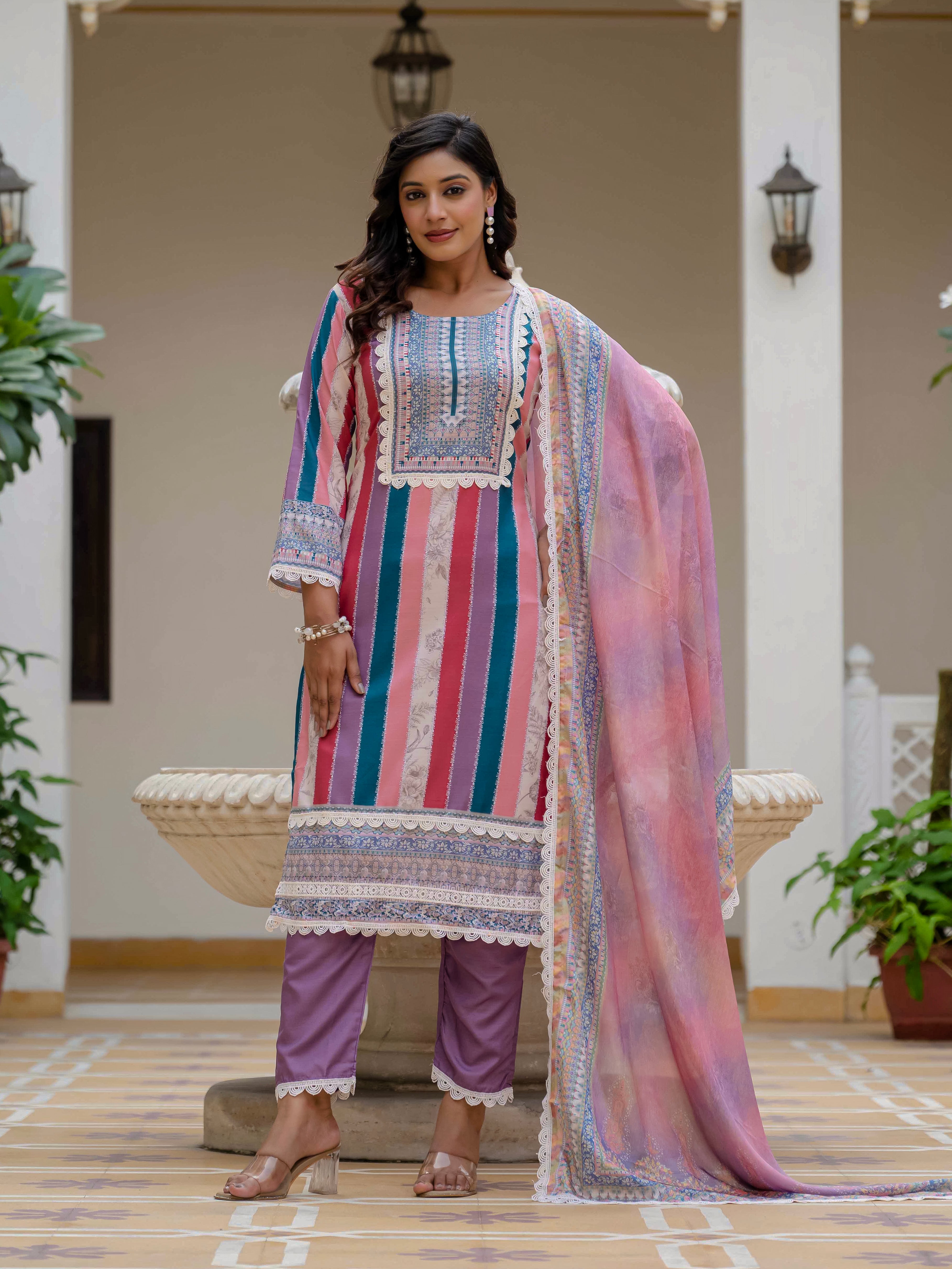 Full shot of model in Laila Pink Kurta Set, showcasing the vibrant striped design and matching purple pants.