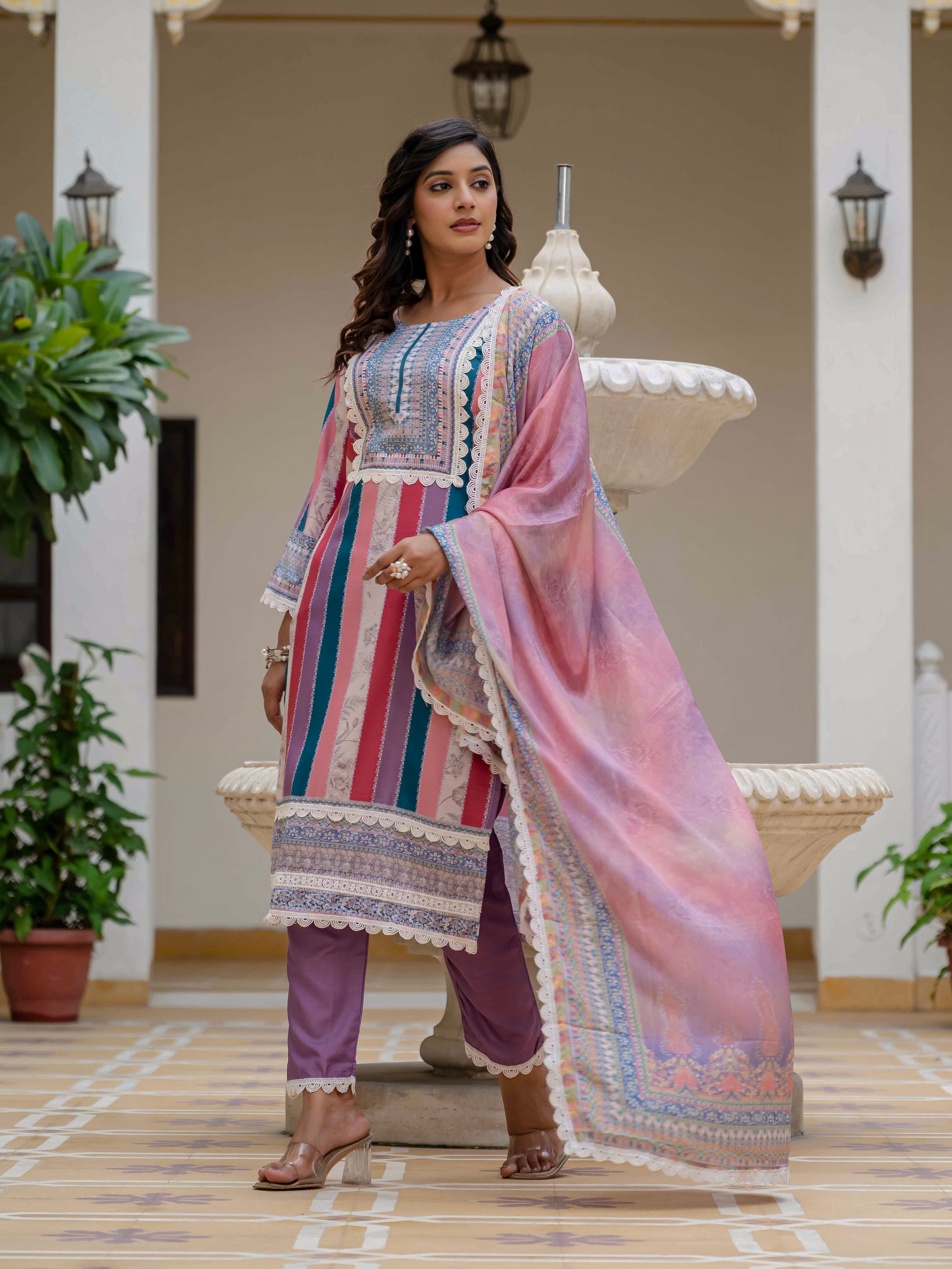 Model in Laila Pink Kurta Set looking away, highlighting the flow and intricate lace border of the dupatta.