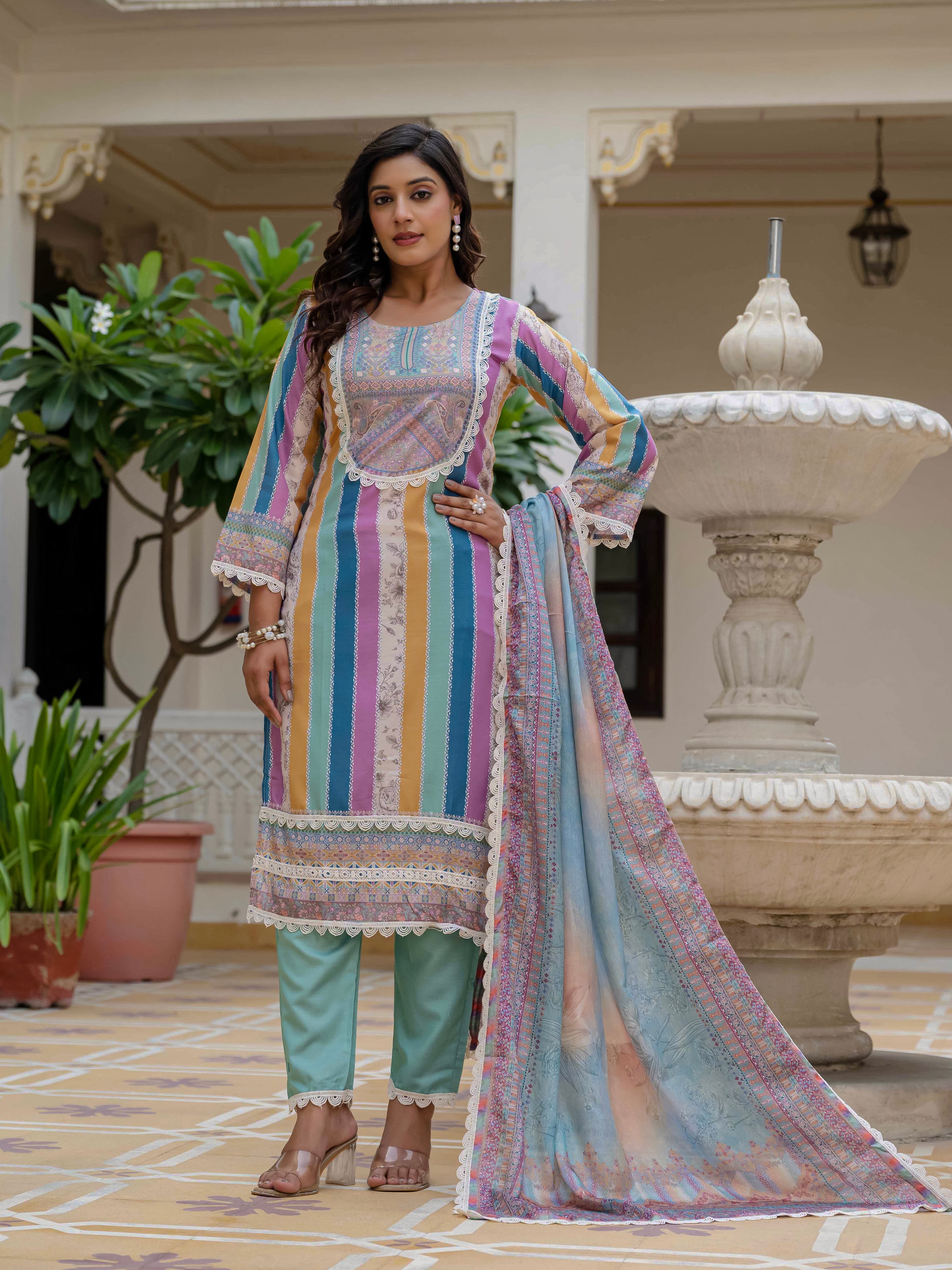 Full length view of model in Laila Sky Kurta Set, confidently posing by the fountain with an elegant stance.