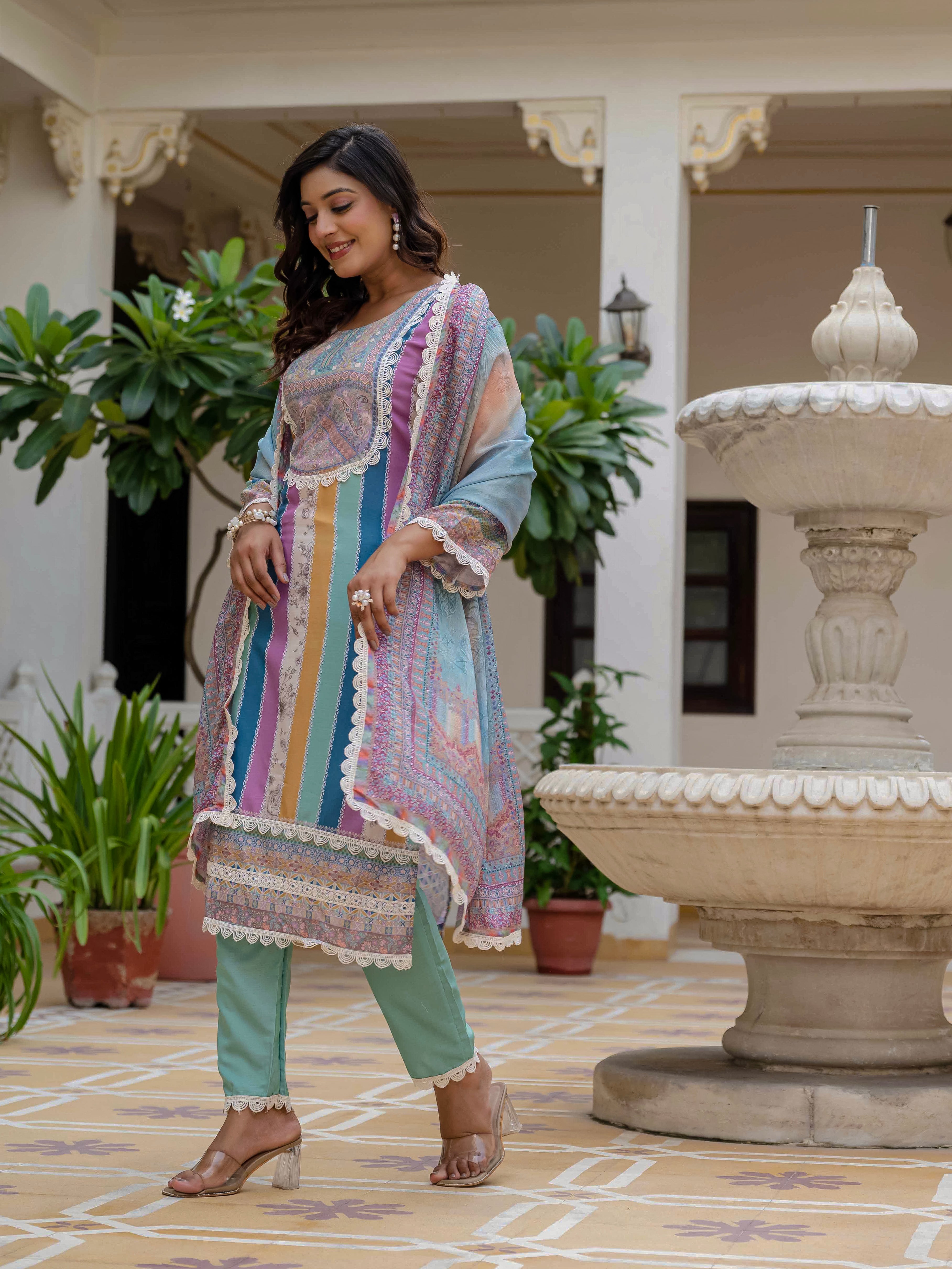 Model in Laila Sky Kurta Set, smiling while adjusting the dupatta, showing movement and flow.
