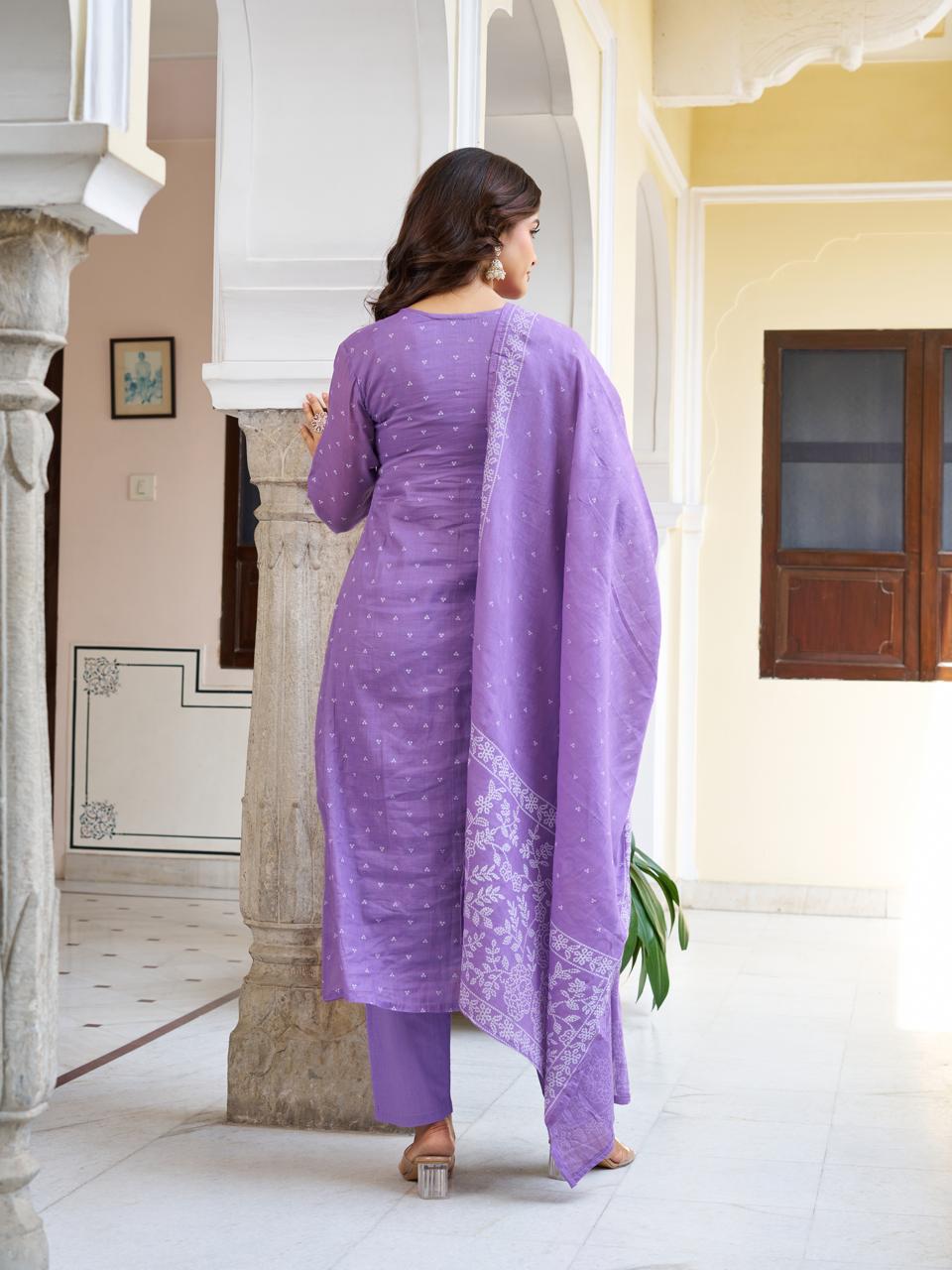 Back view of a model in a lavender embroidered cotton kurti set, showcasing the elegant fit of the pant and the printed dupatta.