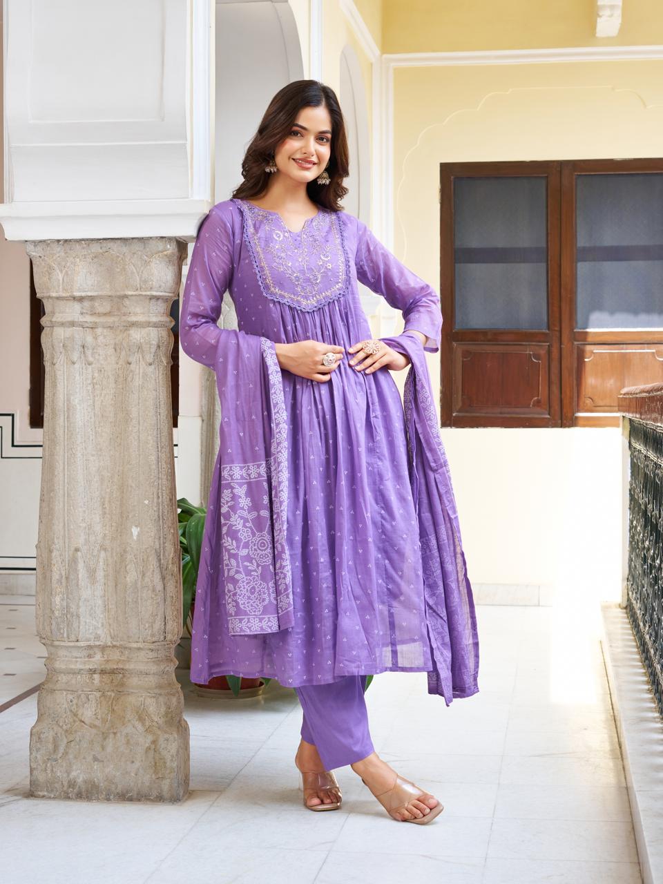 Model posing elegantly in a lavender embroidered kurti set, offering a complete view of the comfortable and stylish three-piece attire.