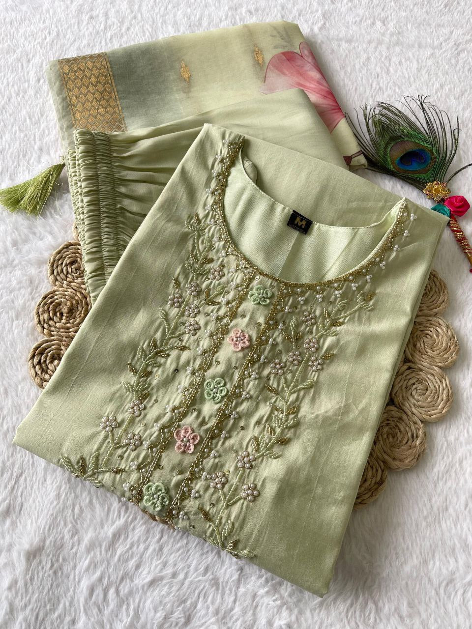Light pista green kurta churidar set with intricate handwork