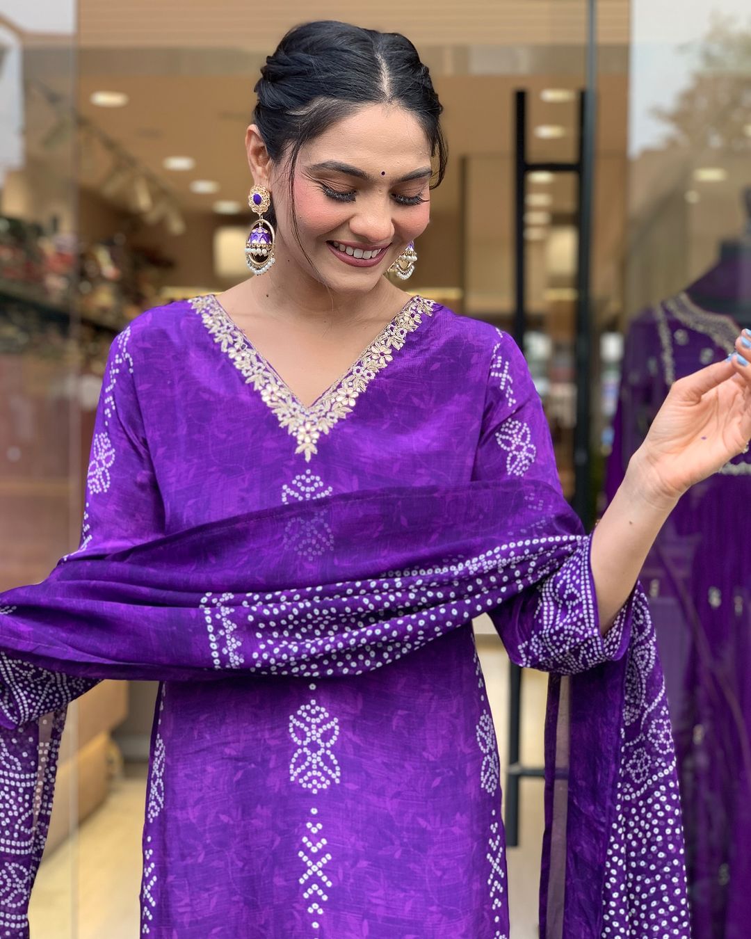 Smiling TRENDBUY woman in Purple kurta set, gently holding her printed chinon dupatta