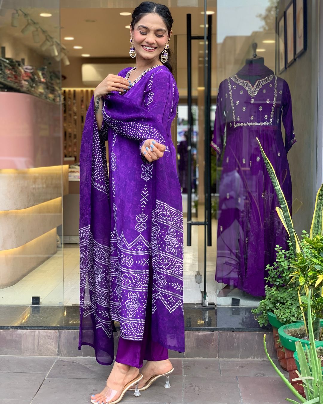 TRENDBUY model in profile, demonstrating the graceful fall of the Purple chinon dupatta with the kurta set
