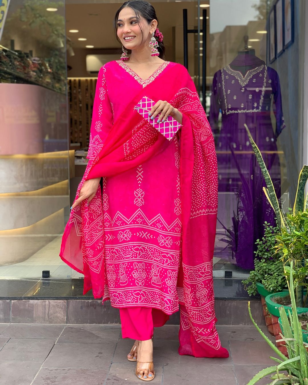 Rani Pink French Crepe embroidered kurta set from TRENDBUY, worn by a smiling model in a retail setting