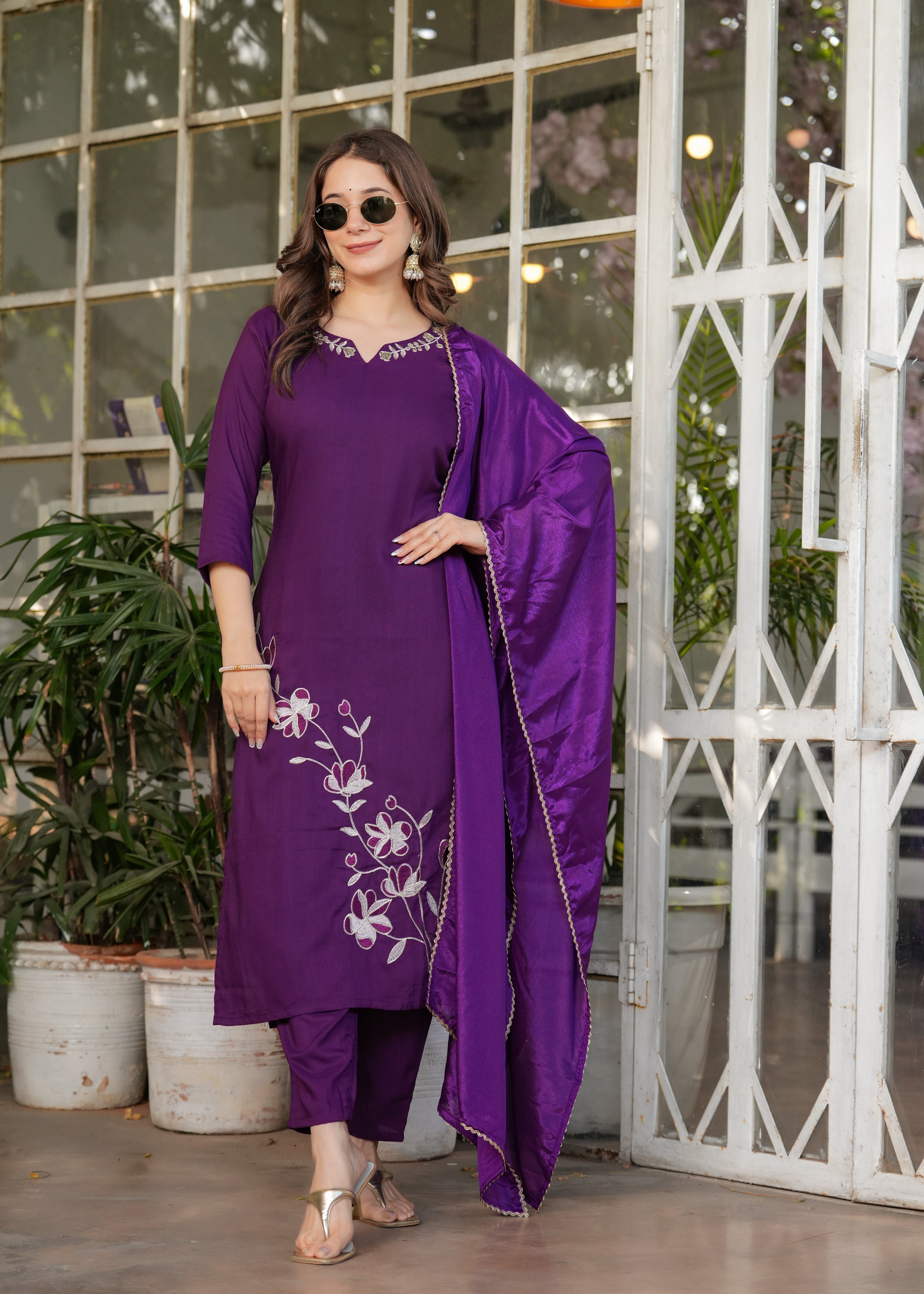 Woman in wine-colored viscose rayon kurta set with white floral embroidery and matching wine chinon dupatta, a TRENDBUY exclusive.