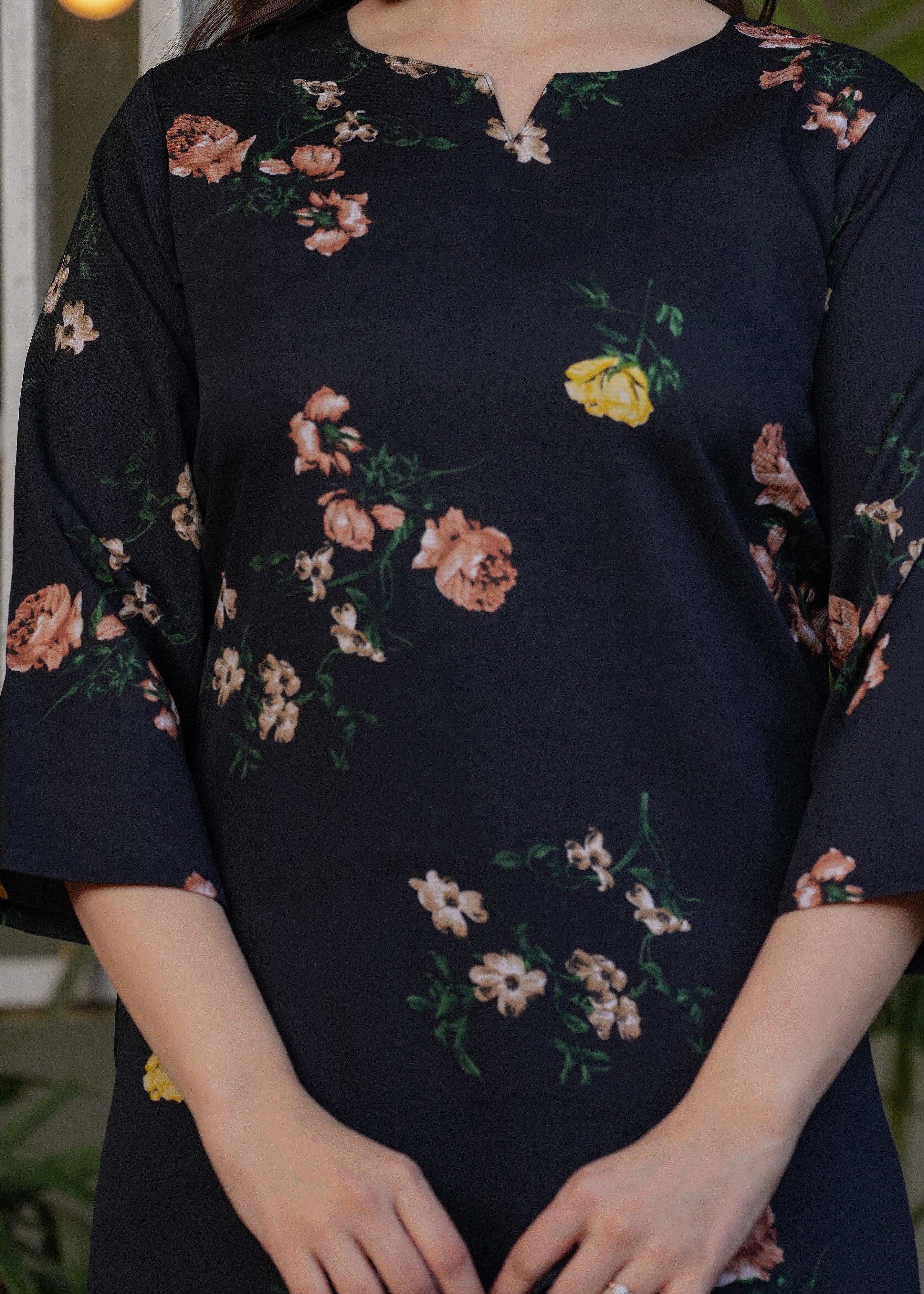 Detailed close-up of the black silk blend kurti fabric, showcasing the beautiful floral print and the quality of the material.