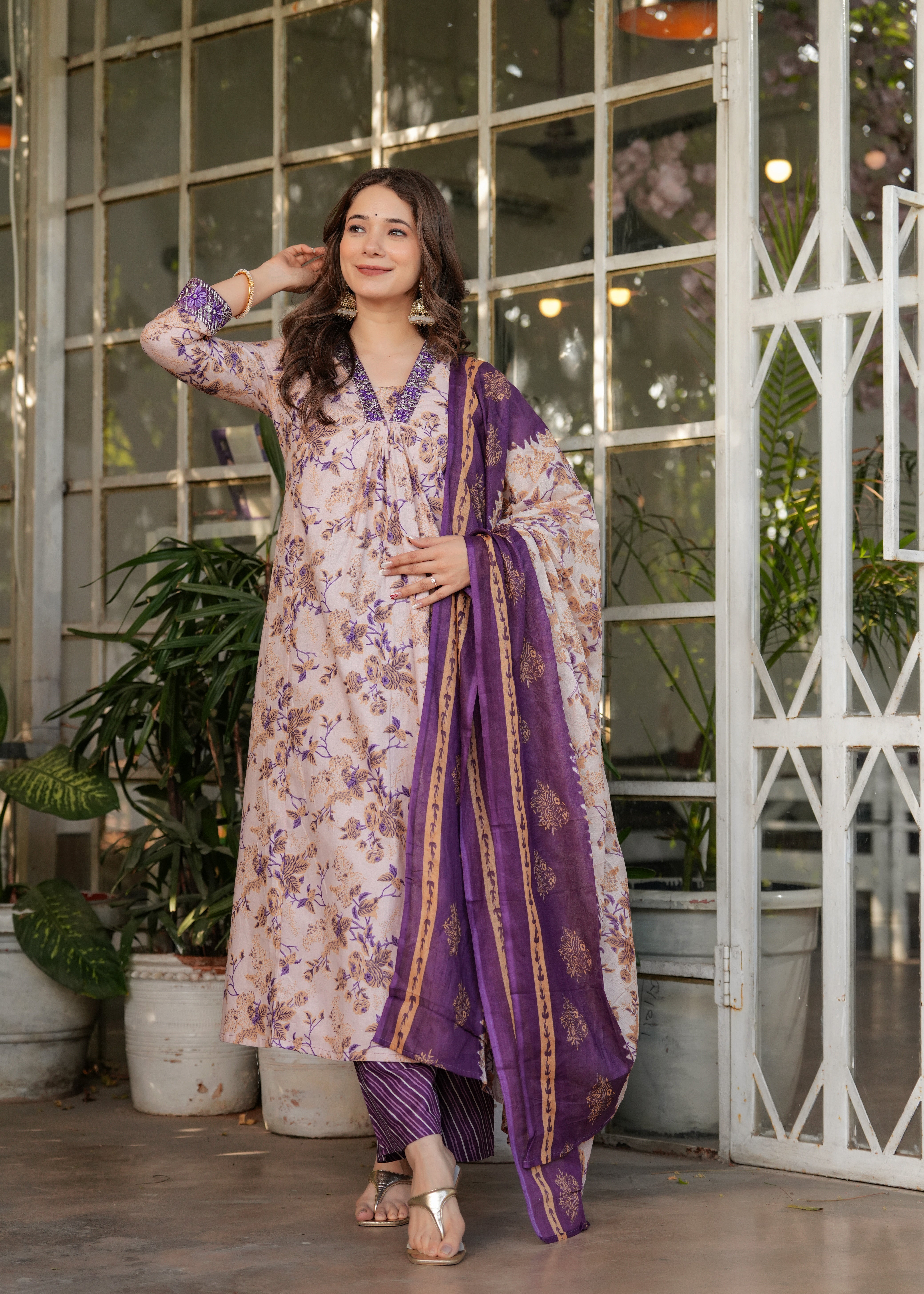 TRENDBUY Women's Pure Cotton Straight Kurta Set in cream with purple floral print, model posing elegantly outdoors.