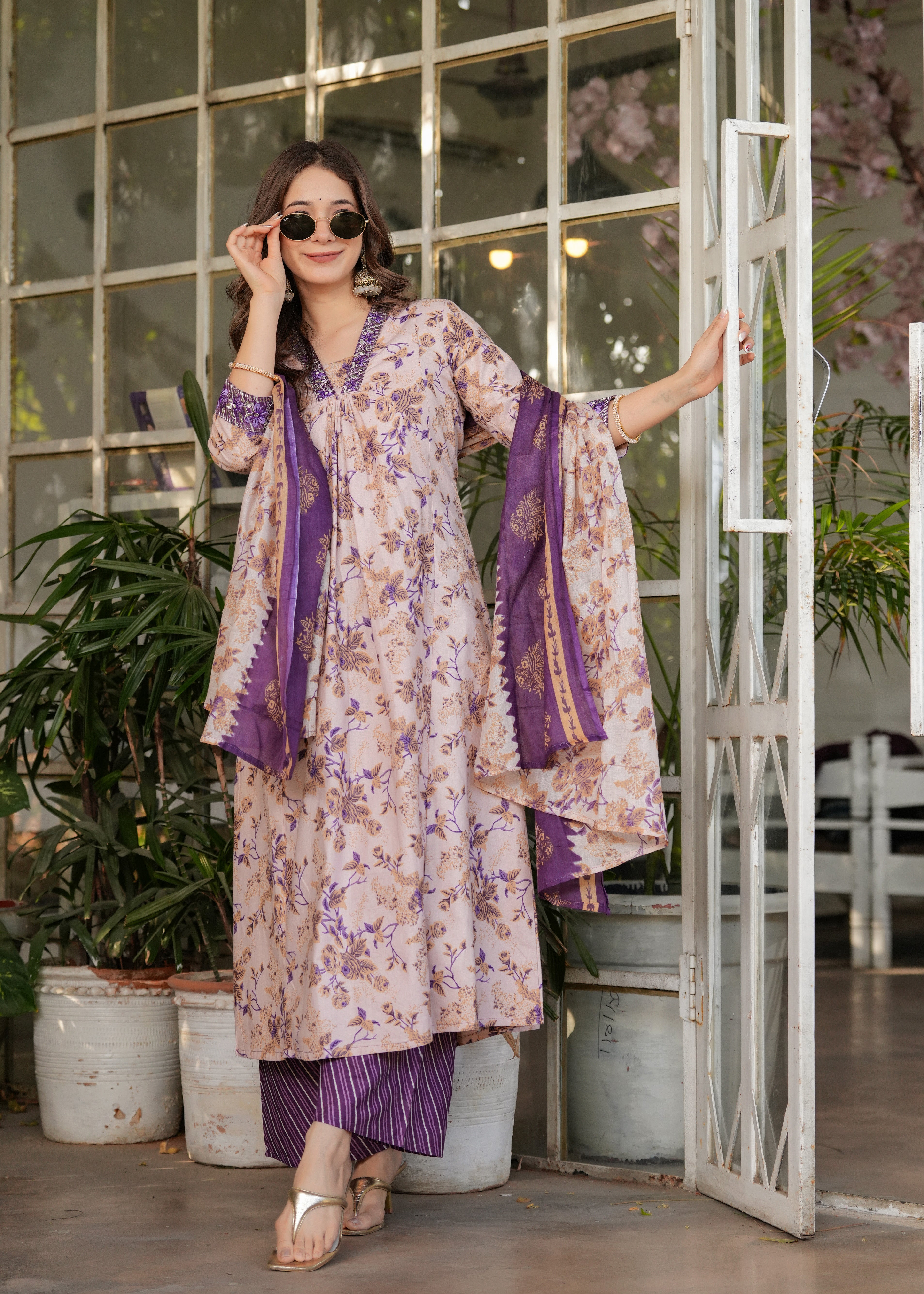 Stylish TRENDBUY cream and purple kurta set, perfect for everyday elegance, model posing casually.