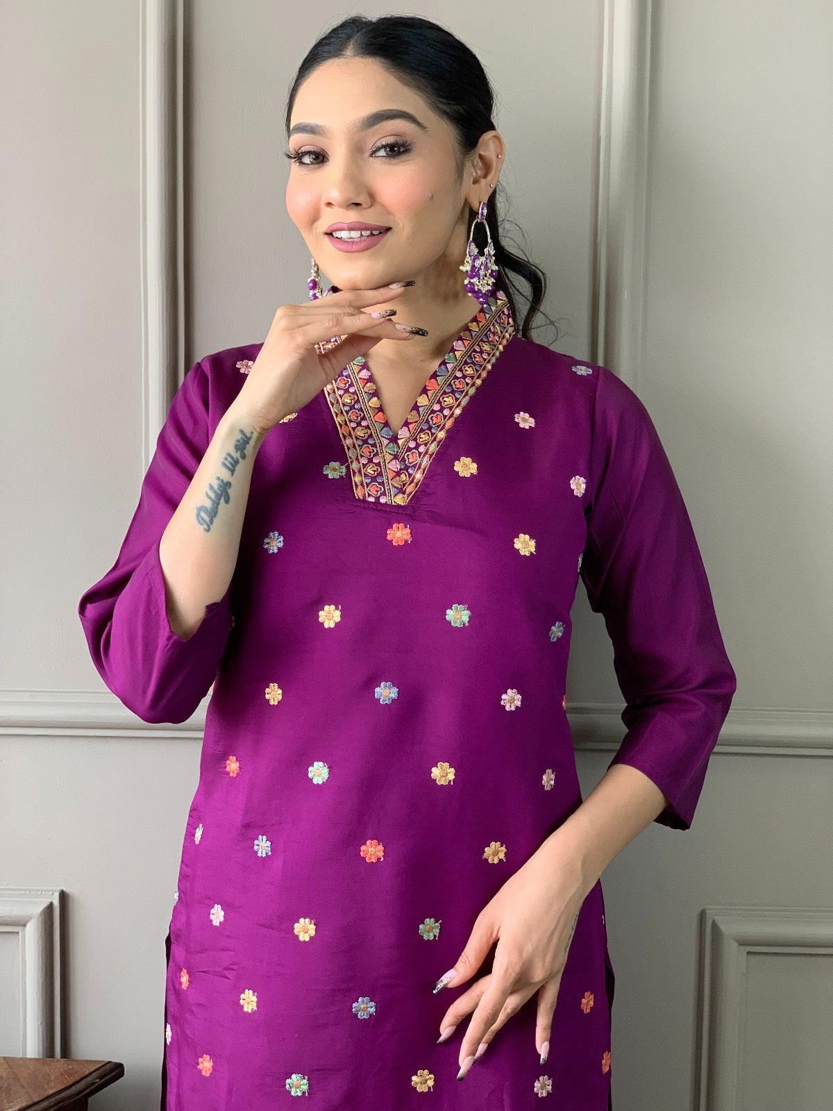 Close-up of woman smiling, highlighting the intricate neck embroidery and delicate floral motifs on the TRENDBUY purple kurta.