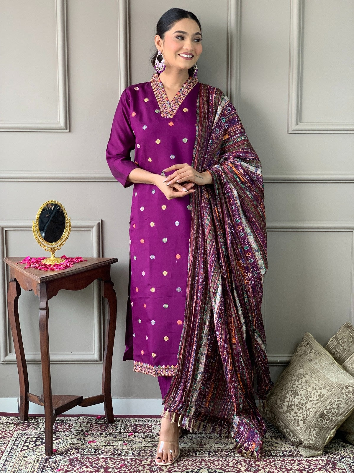 Front full shot of the model confidently wearing the purple embroidered kurta, pant, and heavy printed dupatta set by TRENDBUY.