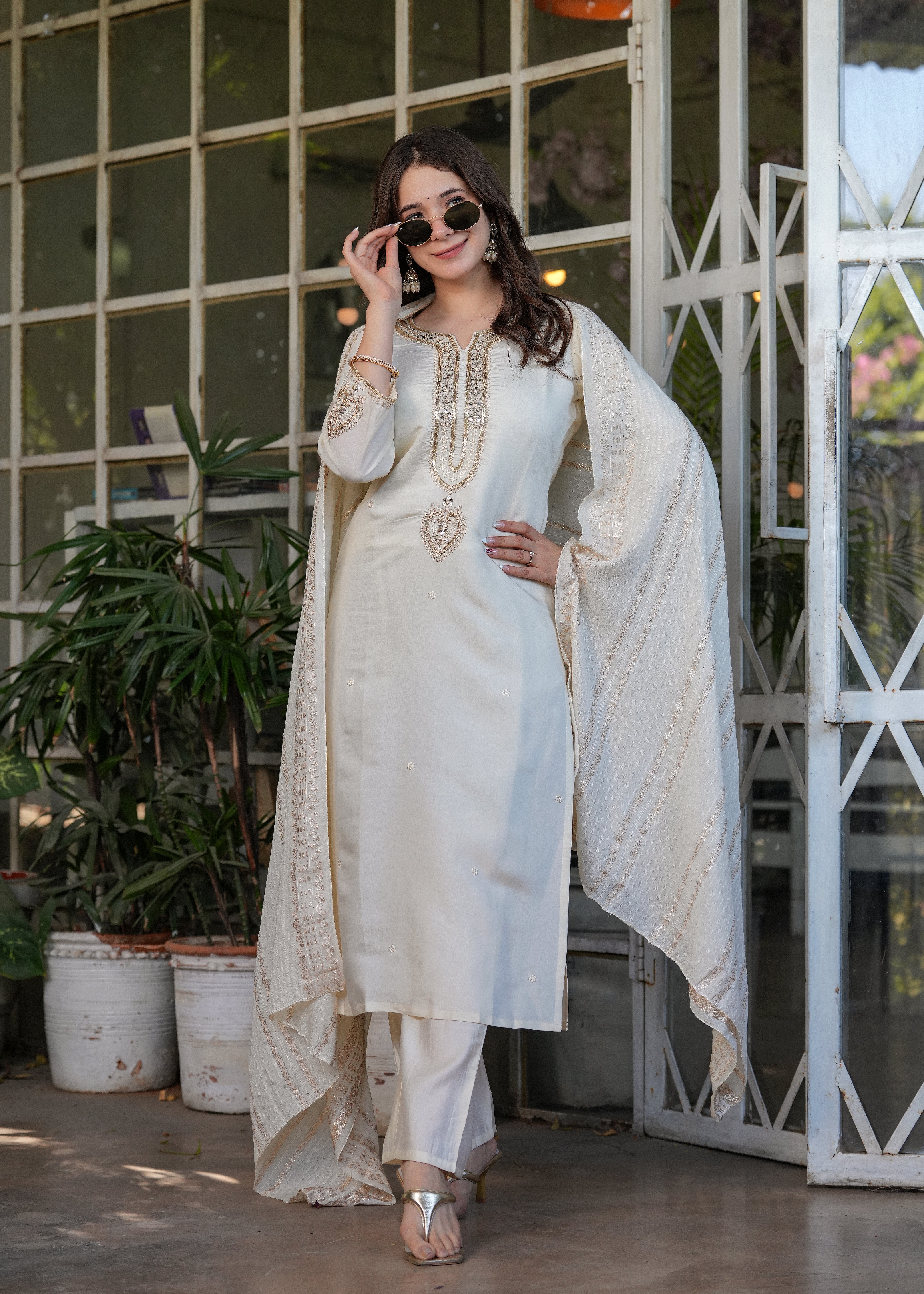 TRENDBUY woman adjusting sunglasses in off-white embroidered kurta set, full length pose