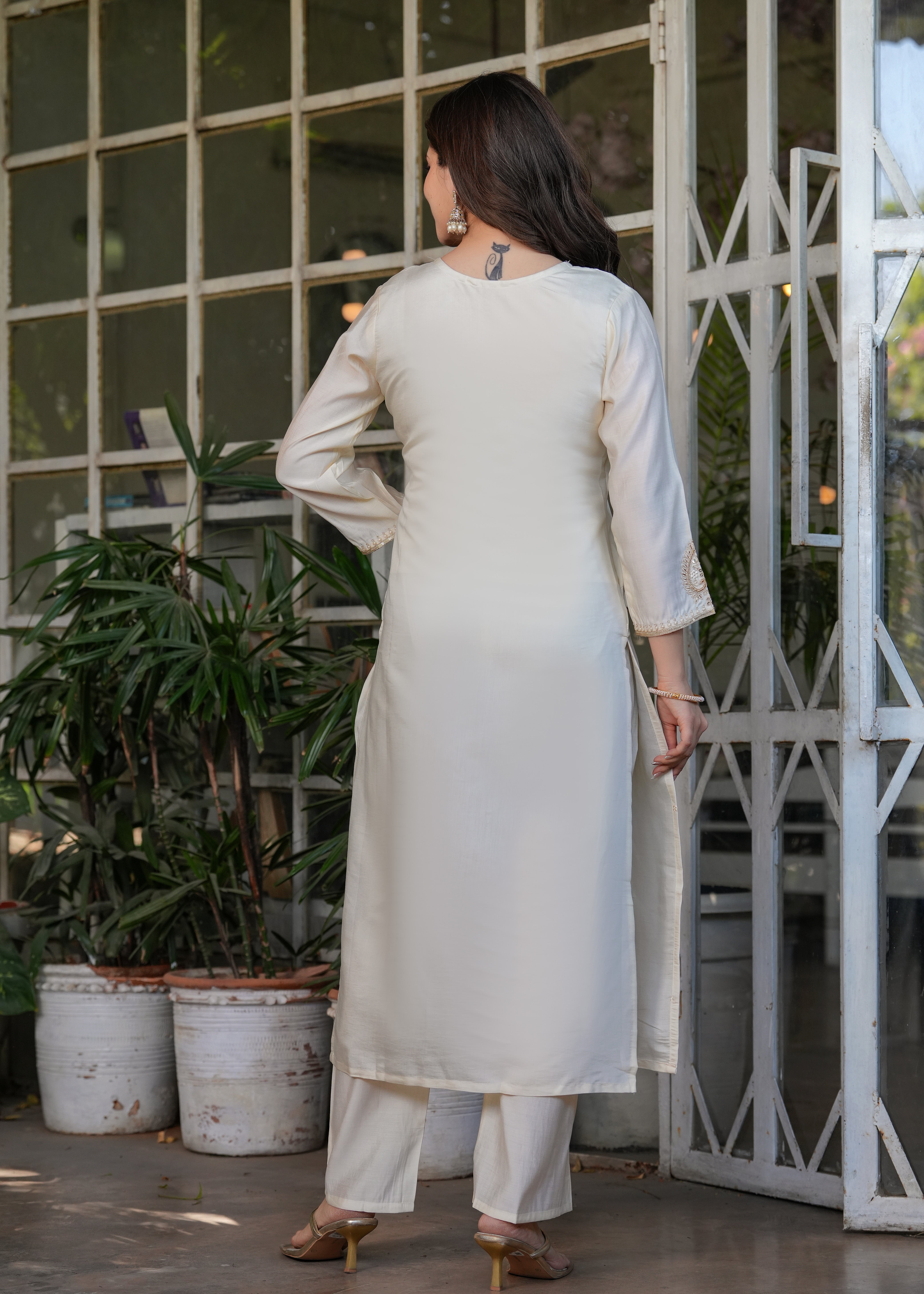 Back view of TRENDBUY woman in off-white Viscose Chanderi embroidered kurta set, straight fit