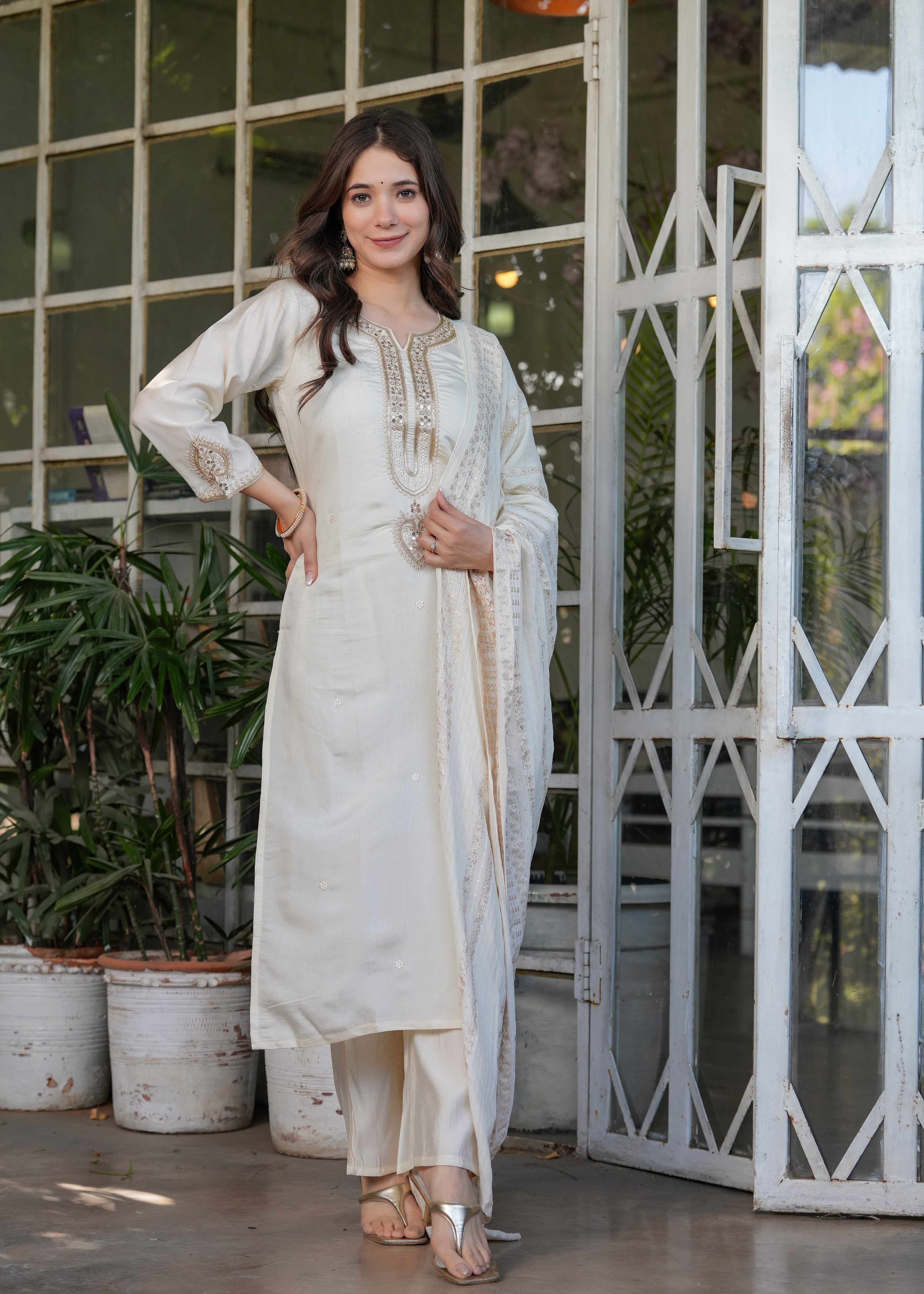TRENDBUY woman confidently posing in off-white Viscose Chanderi embroidered kurta set