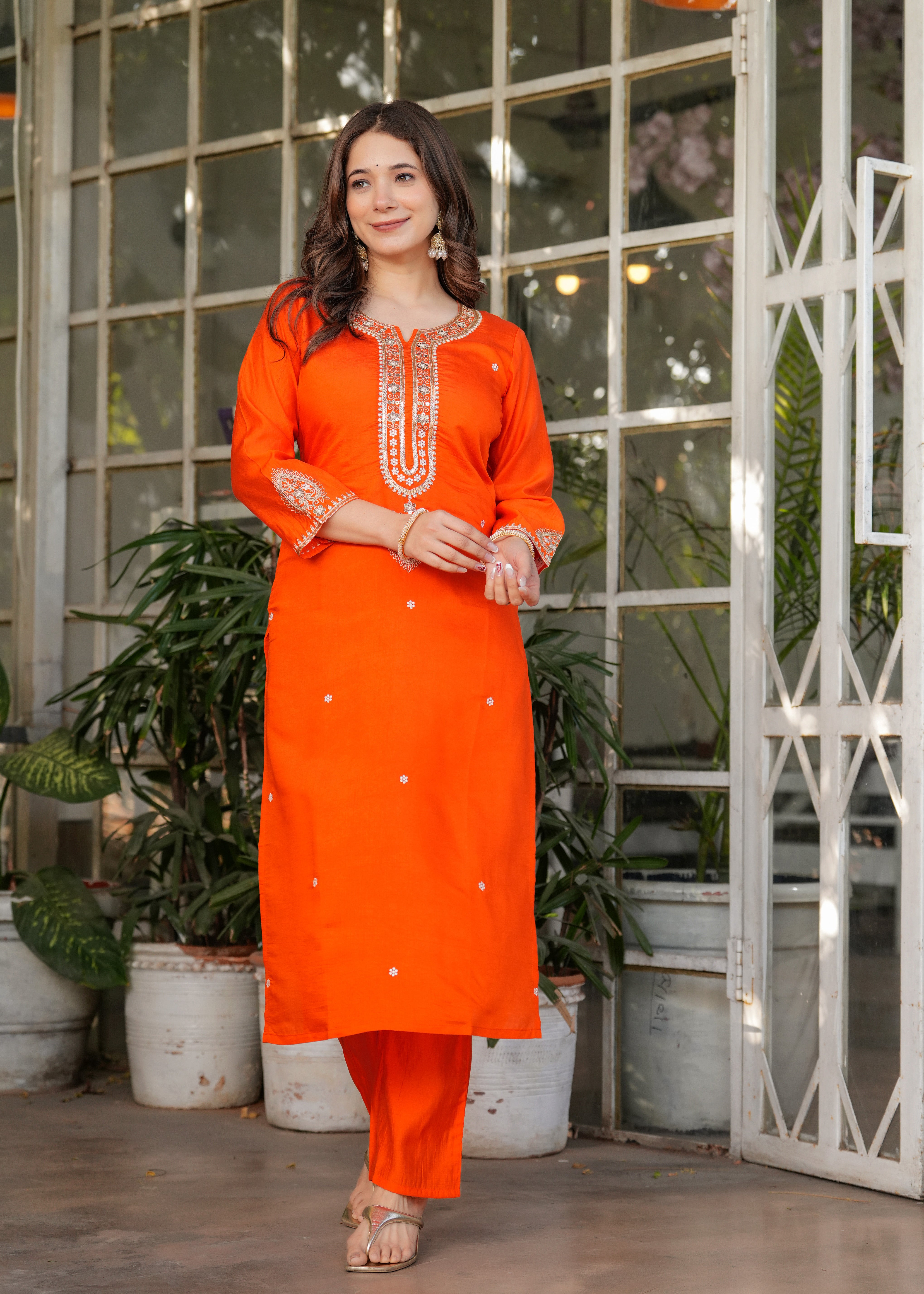 Smiling TRENDBUY woman in orange kurta set, full length, gentle pose