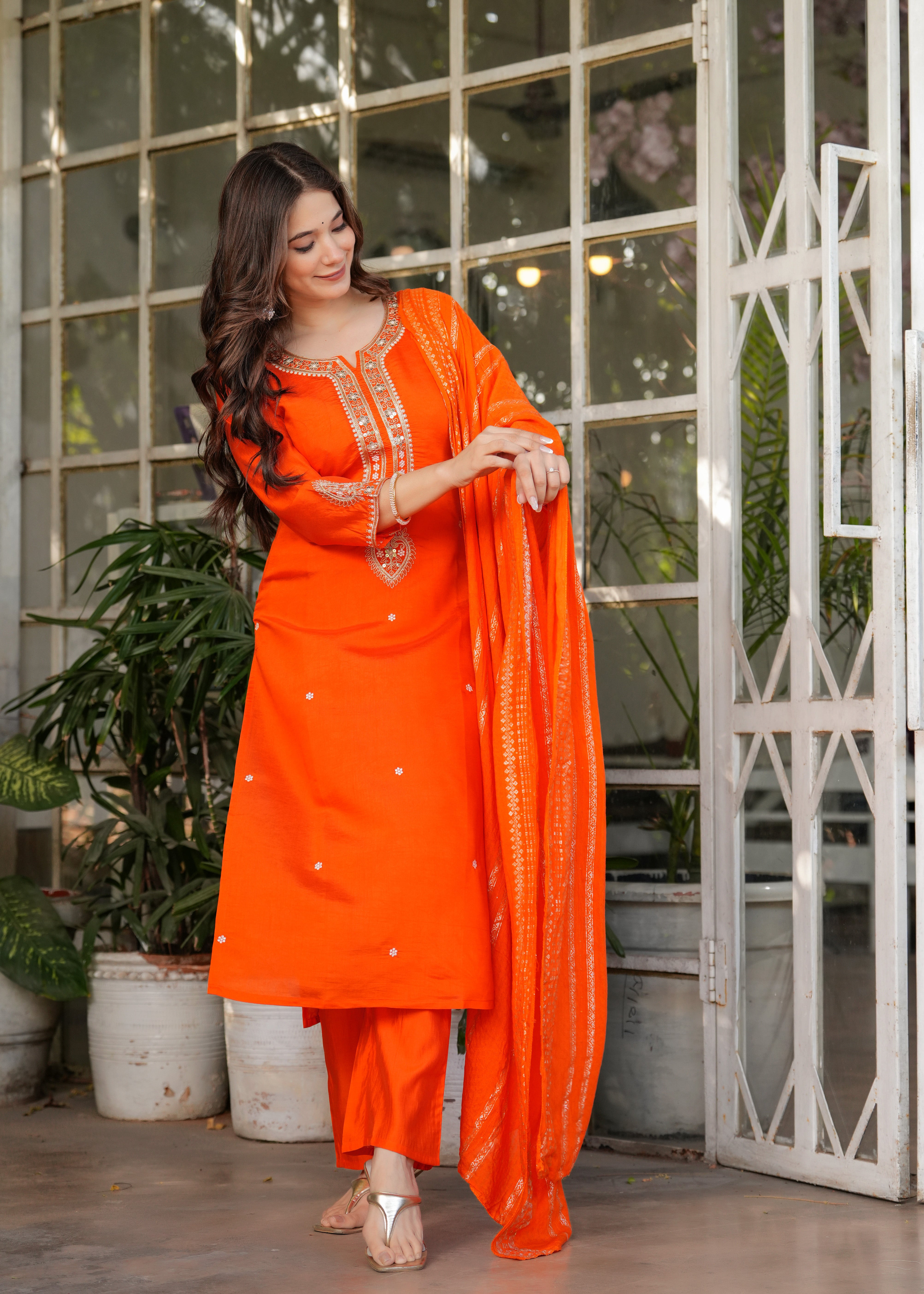 TRENDBUY woman with sunglasses showcasing orange embroidered kurta set and dupatta