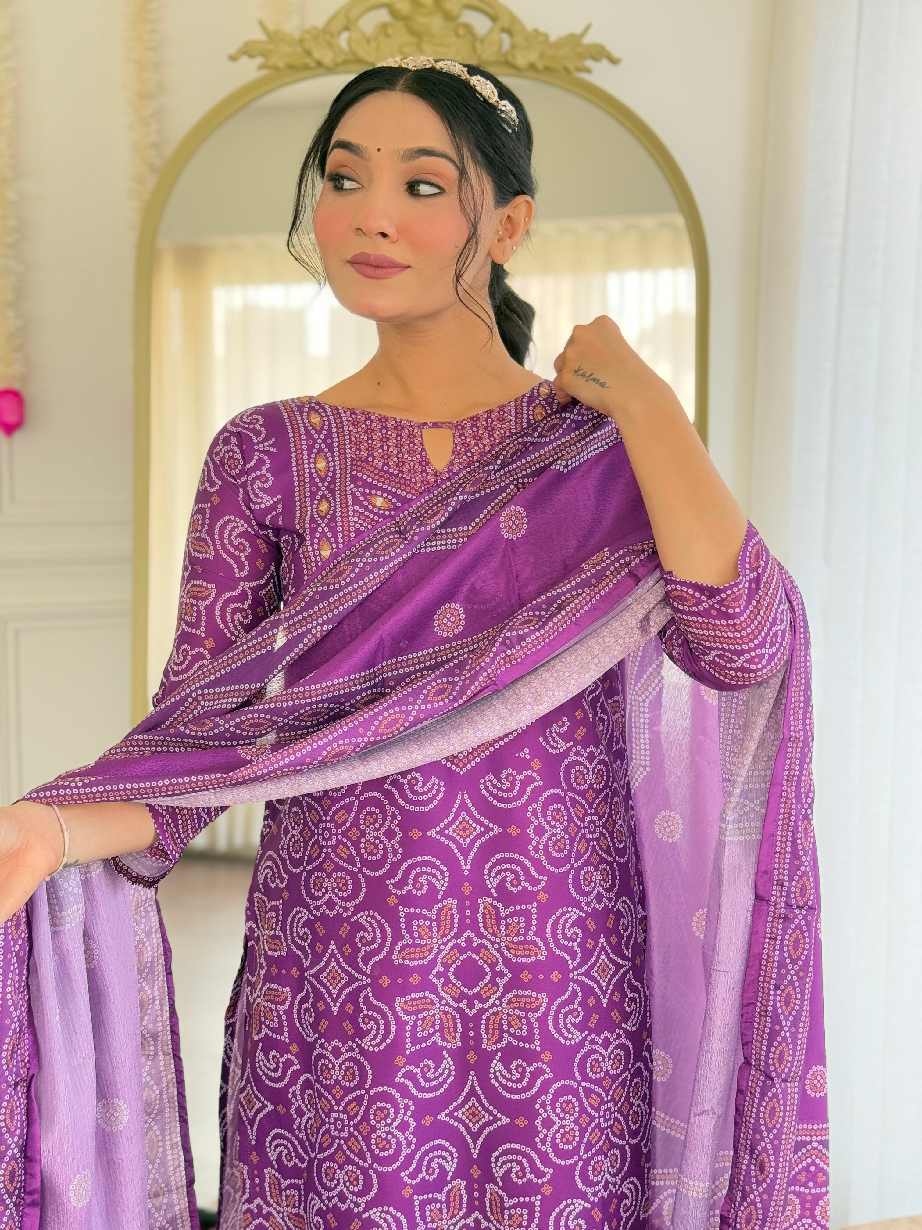 Model adjusting the dupatta, providing a clear view of the kurti's design and matching patterns on the ensemble.