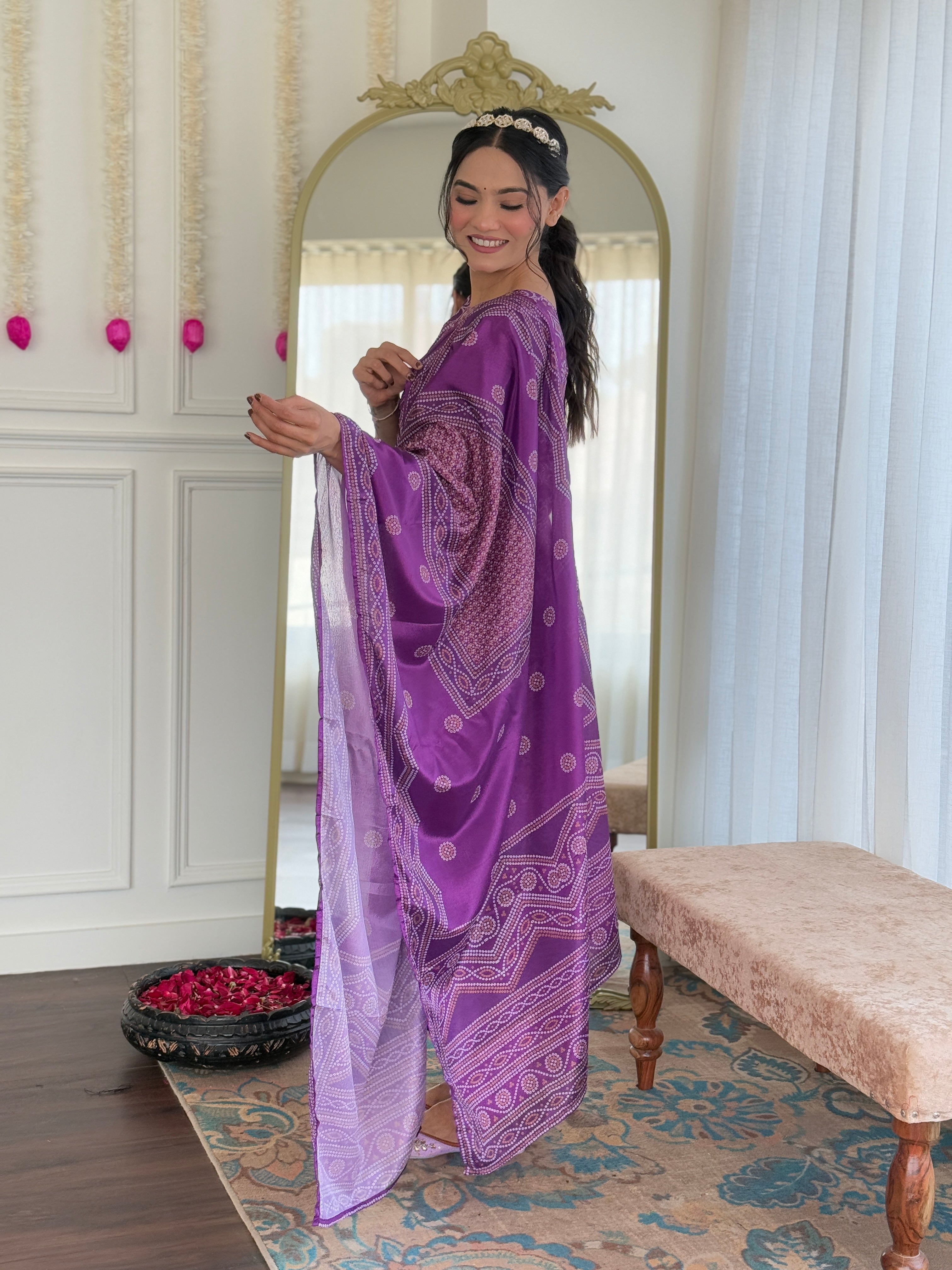 Side profile of a model elegantly displaying the flowing purple chinon dupatta and kurti set.