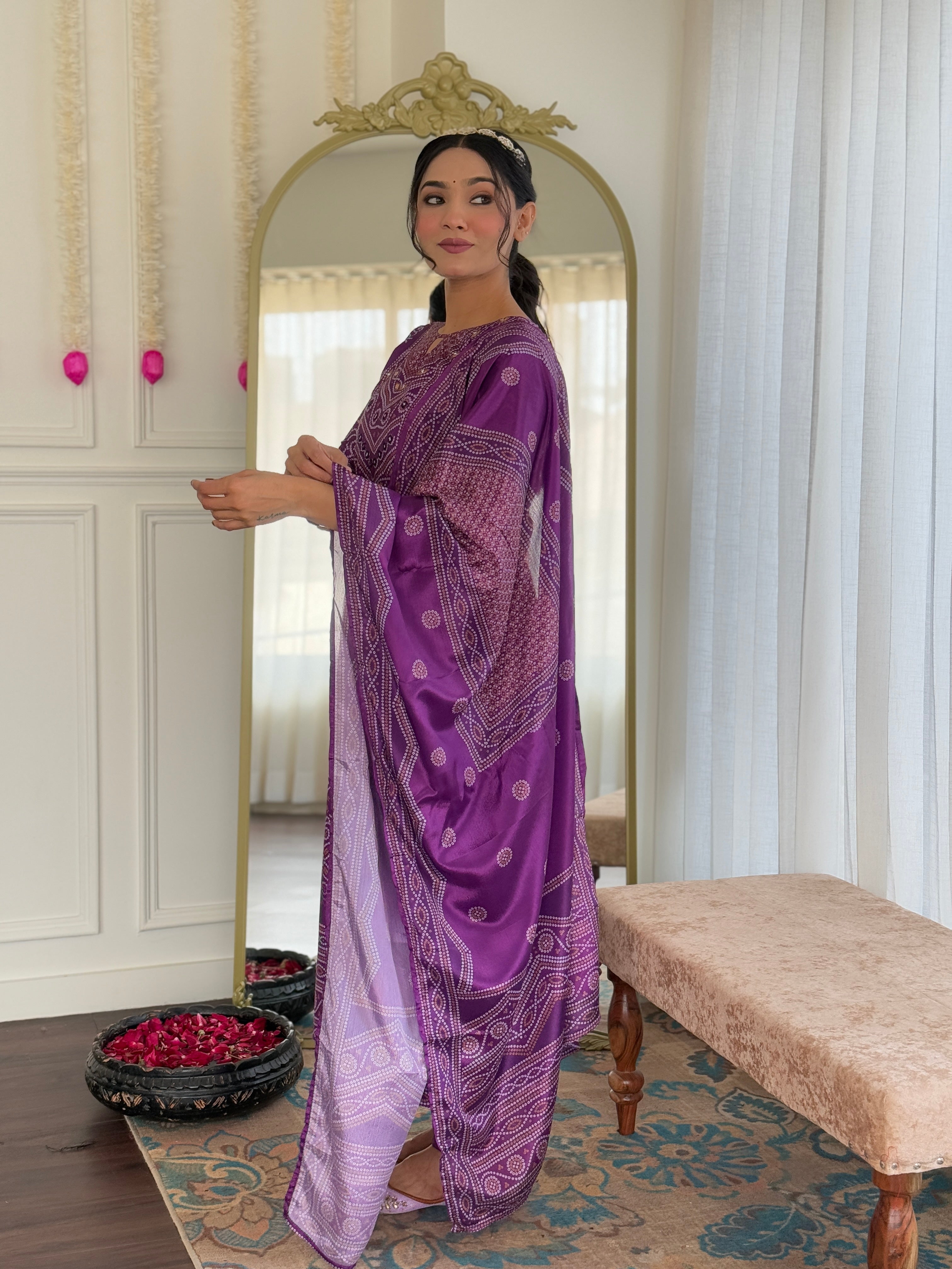 Model in a sophisticated pose, highlighting the full length of the purple kurti pant dupatta set with intricate patterns.