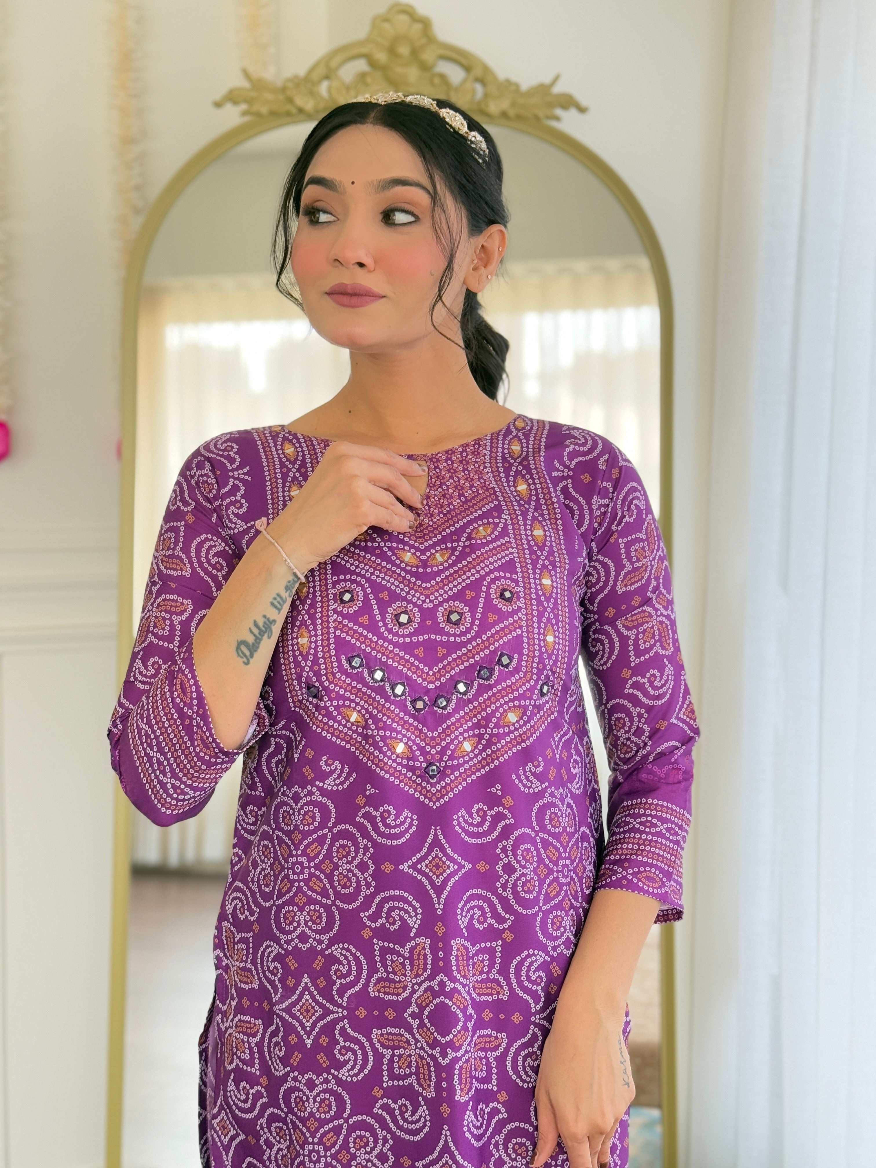 Detailed close-up of the kurti's neckline with exquisite hand mirror embroidery and geometric patterns.