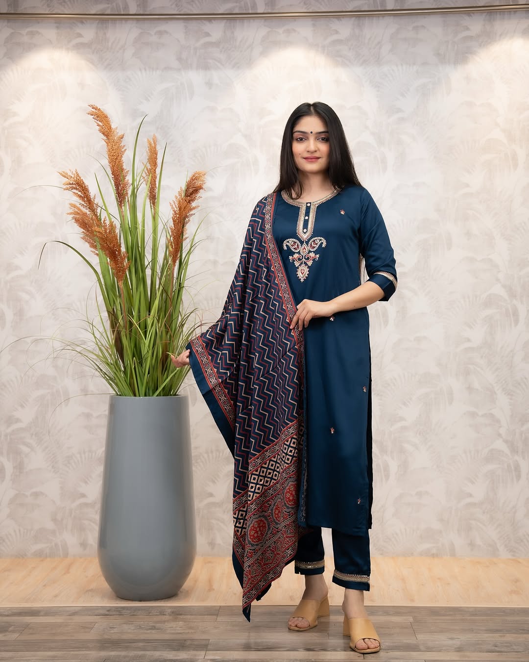 Full shot of woman in elegant deep blue Chanderi Silk Kurta Set with printed muslin dupatta, standing gracefully