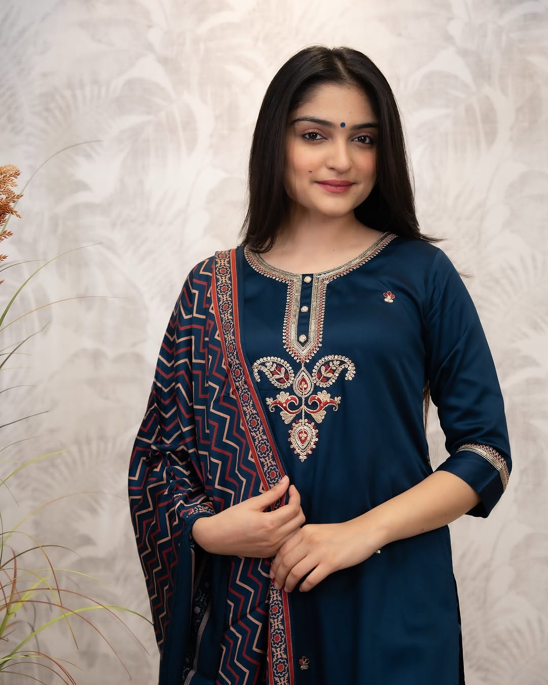 Close-up of woman in deep blue Chanderi Silk Kurta, showing intricate hand-printed embroidery on the neckline