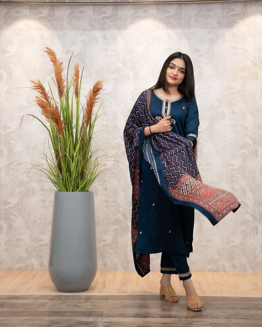 Woman in deep blue Chanderi Silk Kurta Set with dupatta flowing, showcasing the outfit's movement and style
