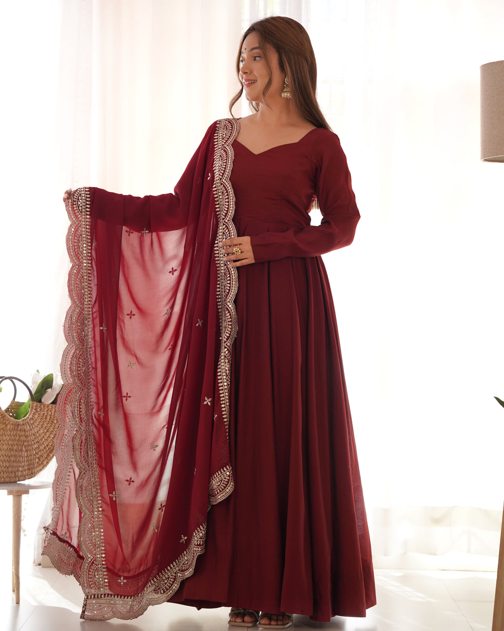 Maroon Anarkali gown, dupatta, and pant set modeled.