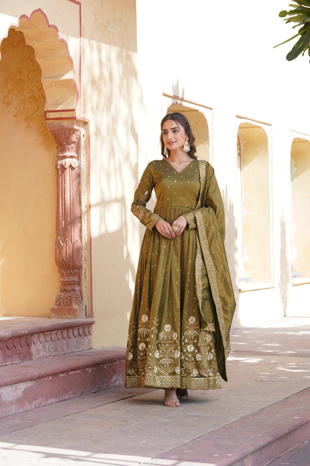 Mehendi green viscose embroidered gown with zari, sequins & matching duppatta.