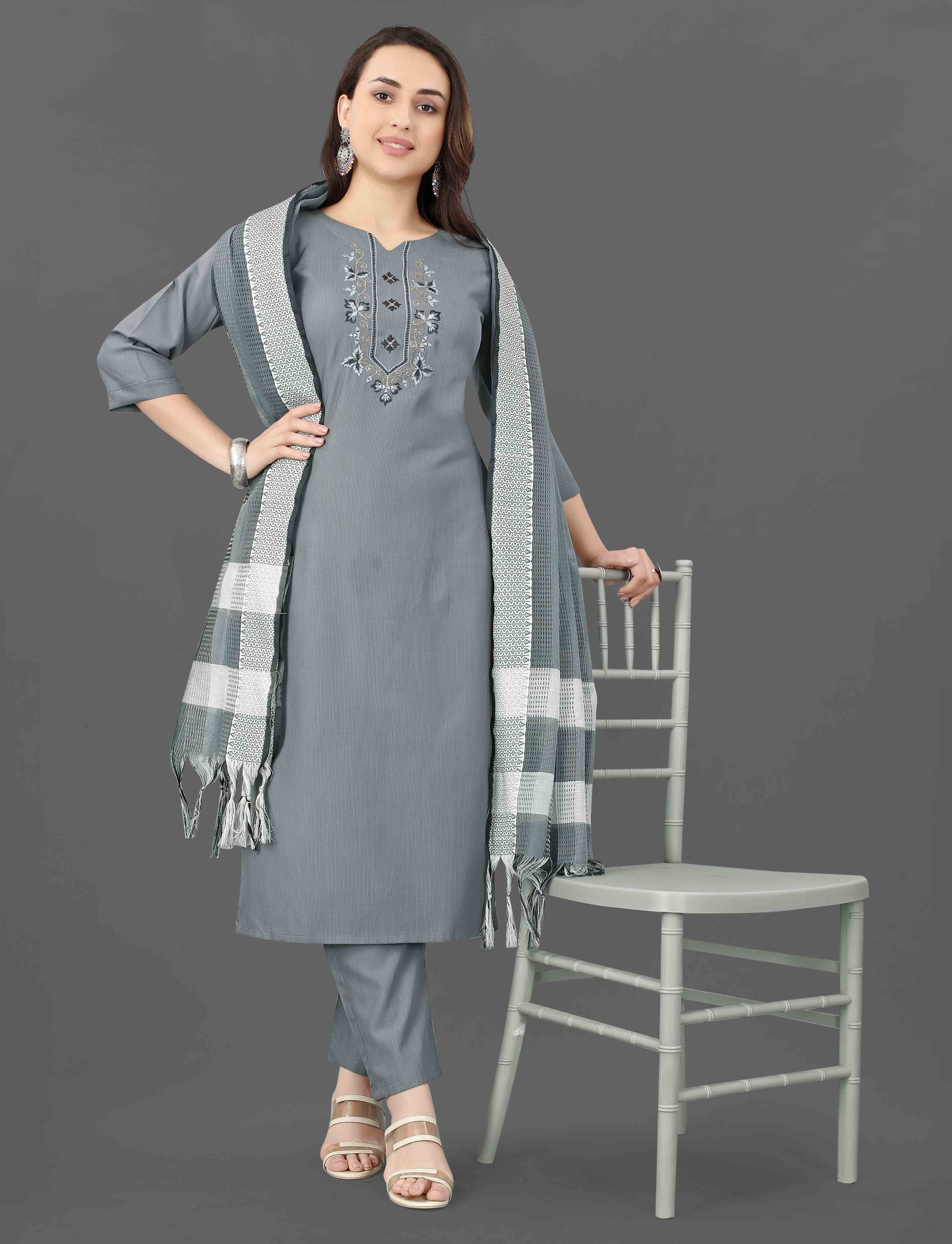 Woman confidently posing in a grey TRENDBUY Mohini cotton blend kurti set with intricate embroidery and mirror work.