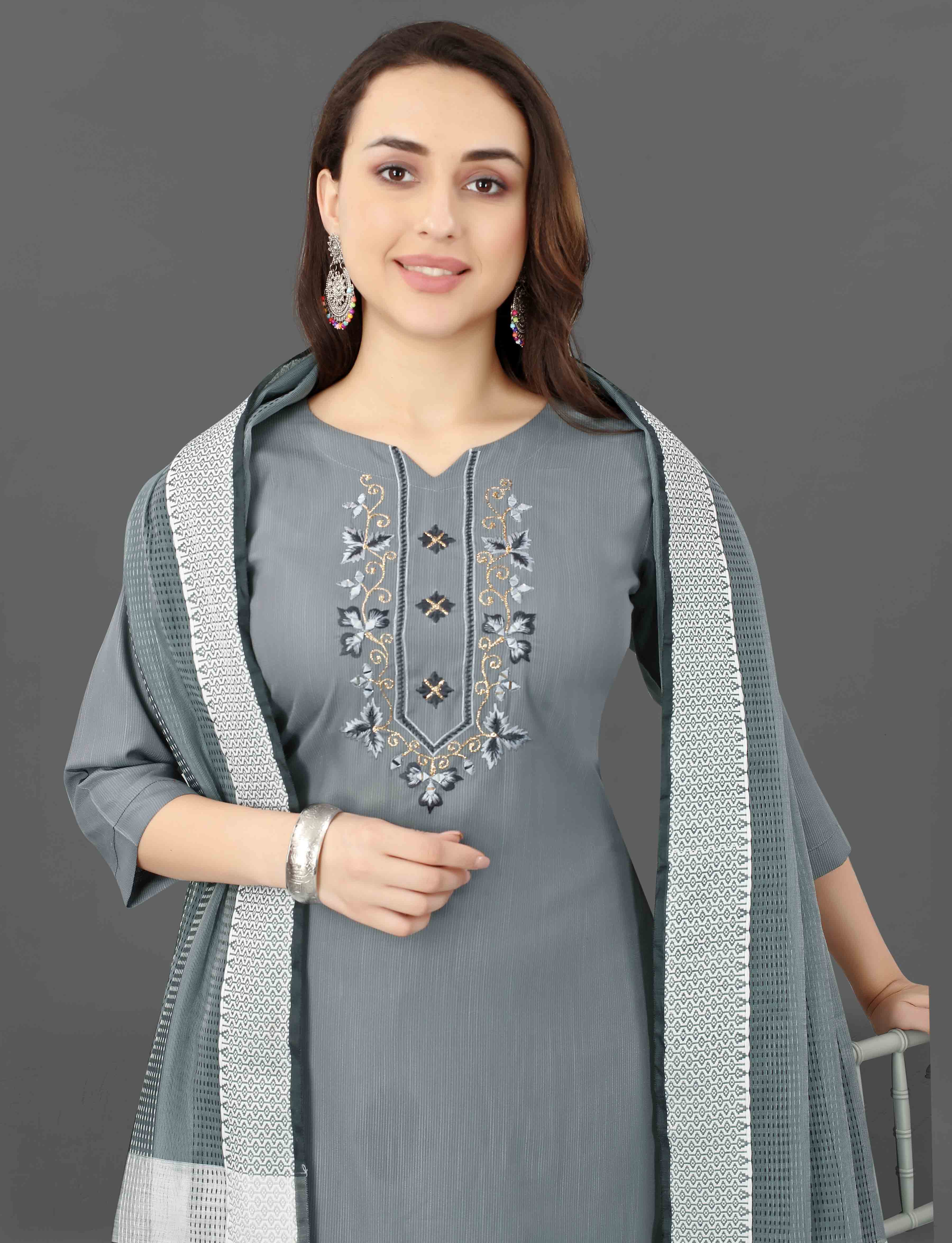 Detailed shot of the V-neckline of the grey kurti, revealing the delicate embroidery and shimmering mirror work.