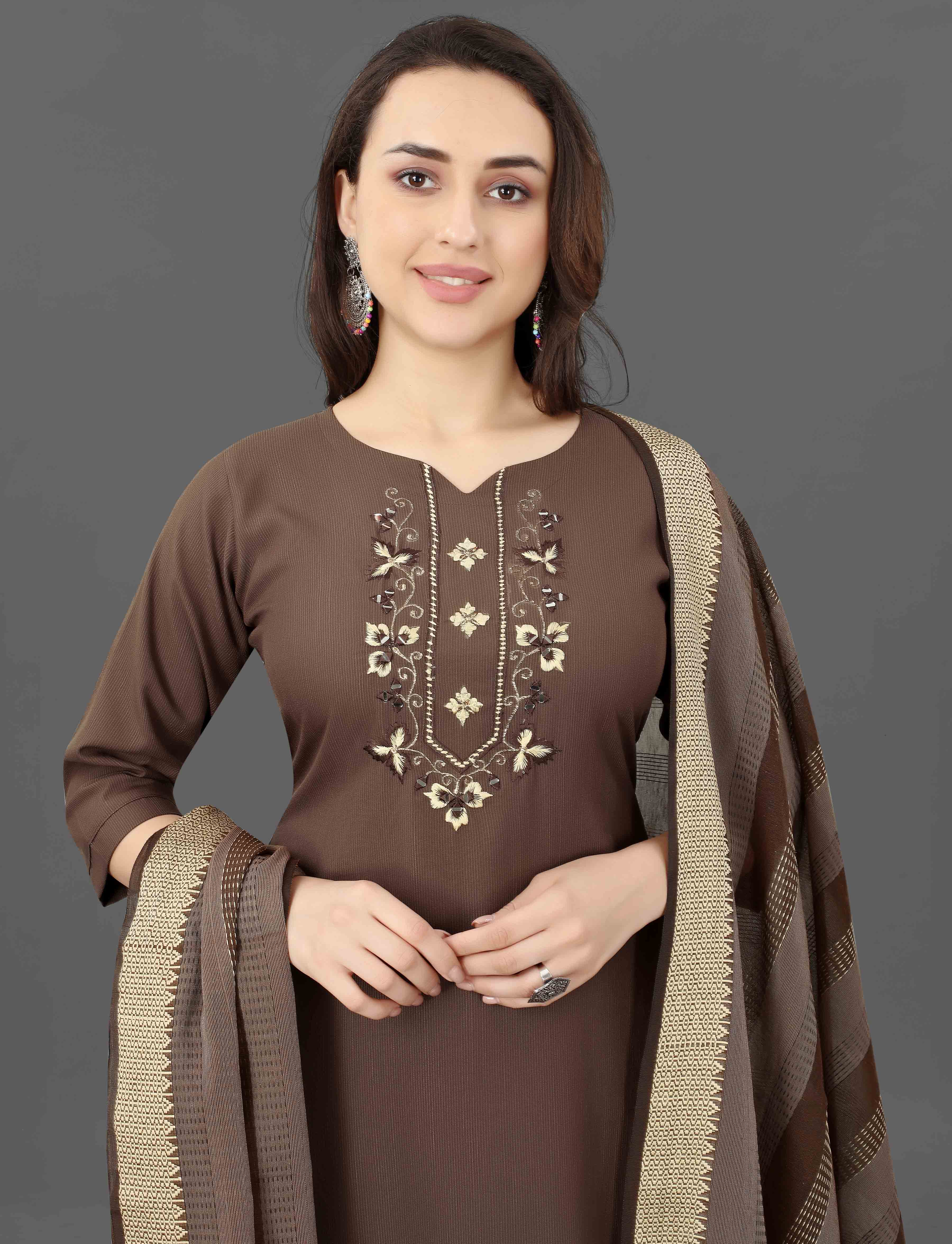 Woman confidently posing in a brown TRENDBUY Mohini cotton blend kurti set with intricate embroidery and mirror work.