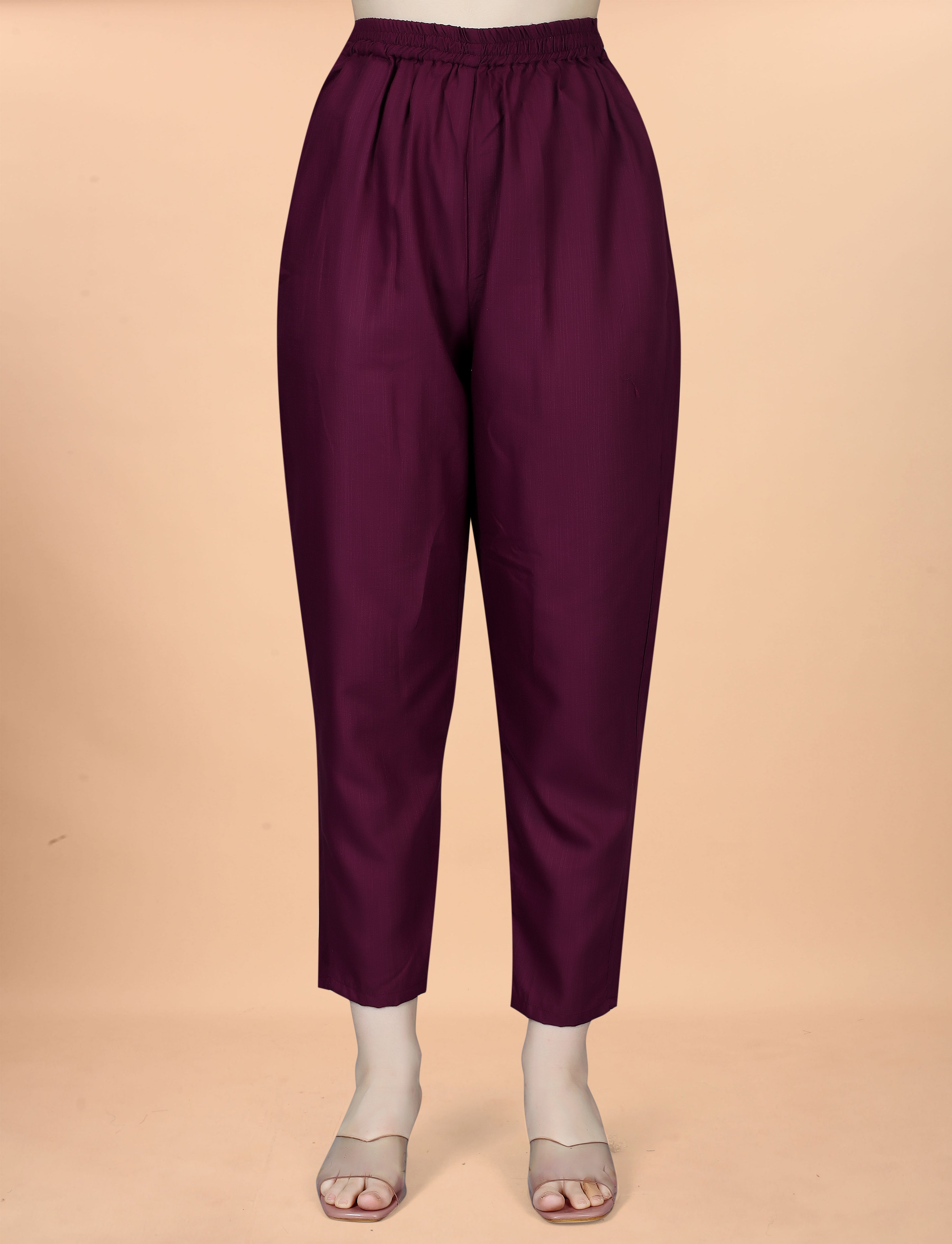 Close-up of a plum cotton blend pant on a mannequin, showcasing fabric texture and fit for a women's ethnic set.