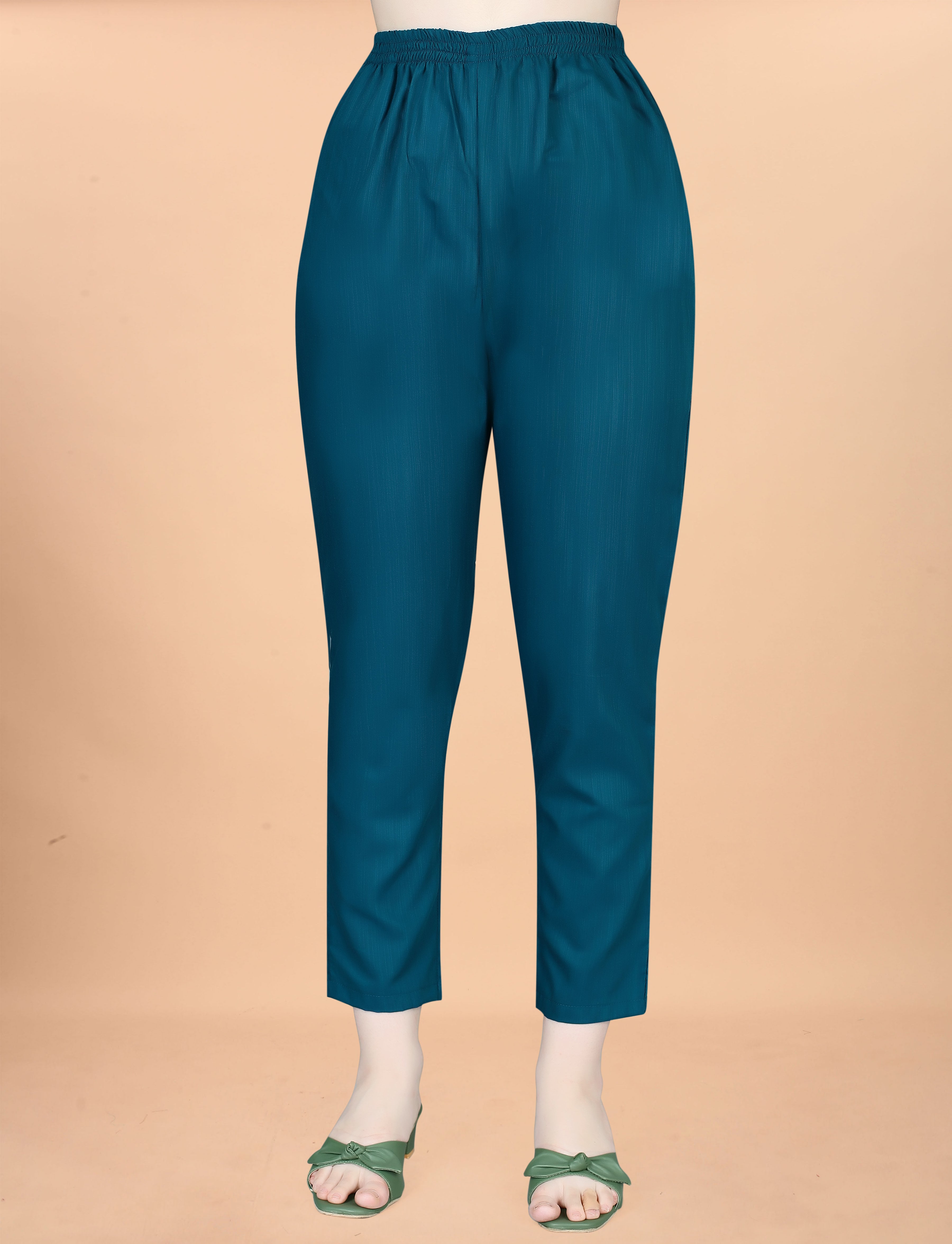 Close-up of a teal cotton blend pant on a mannequin, highlighting the fabric and style for a women's ethnic set.