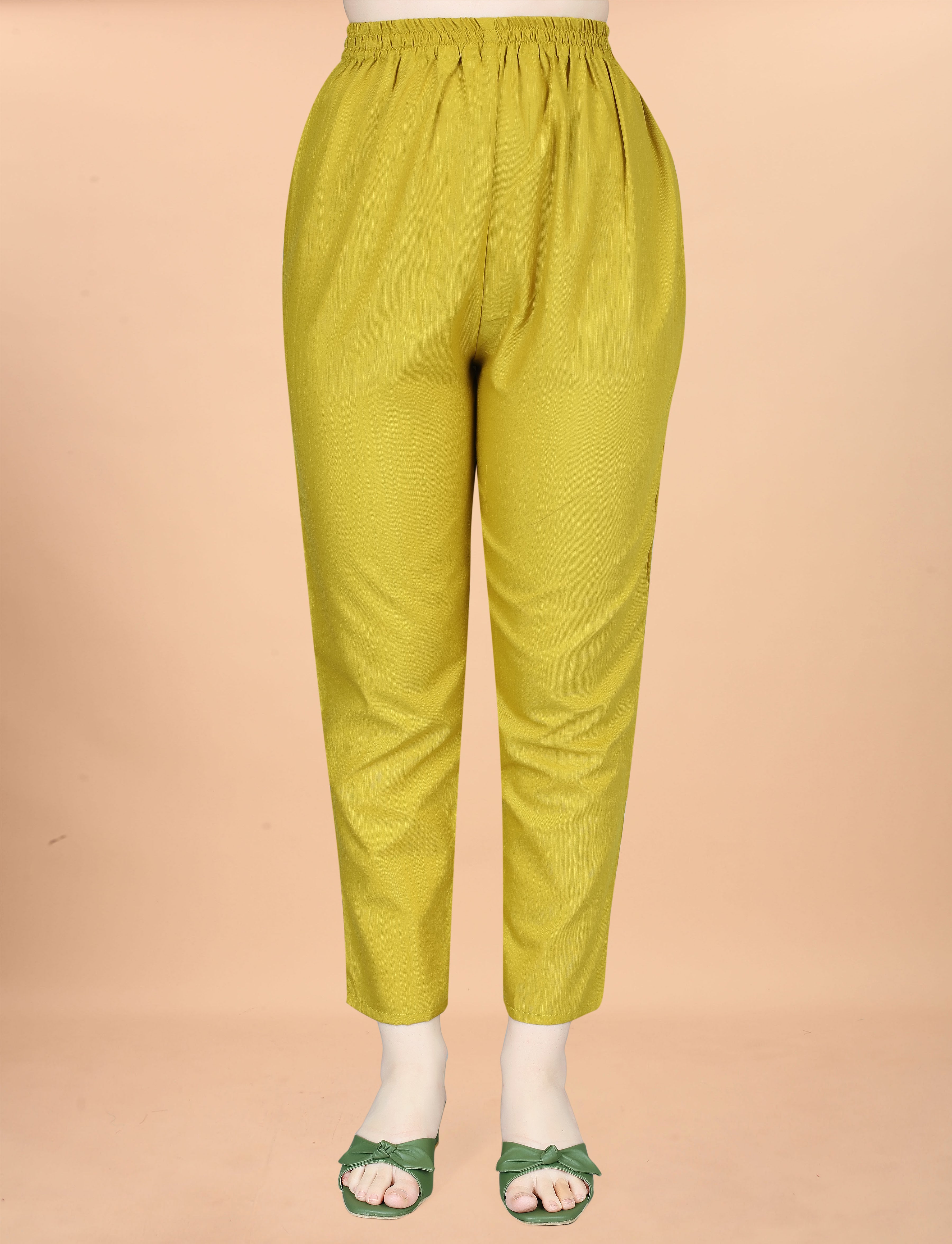 Close-up of olive green cotton blend women's pant with elastic waist on a mannequin.
