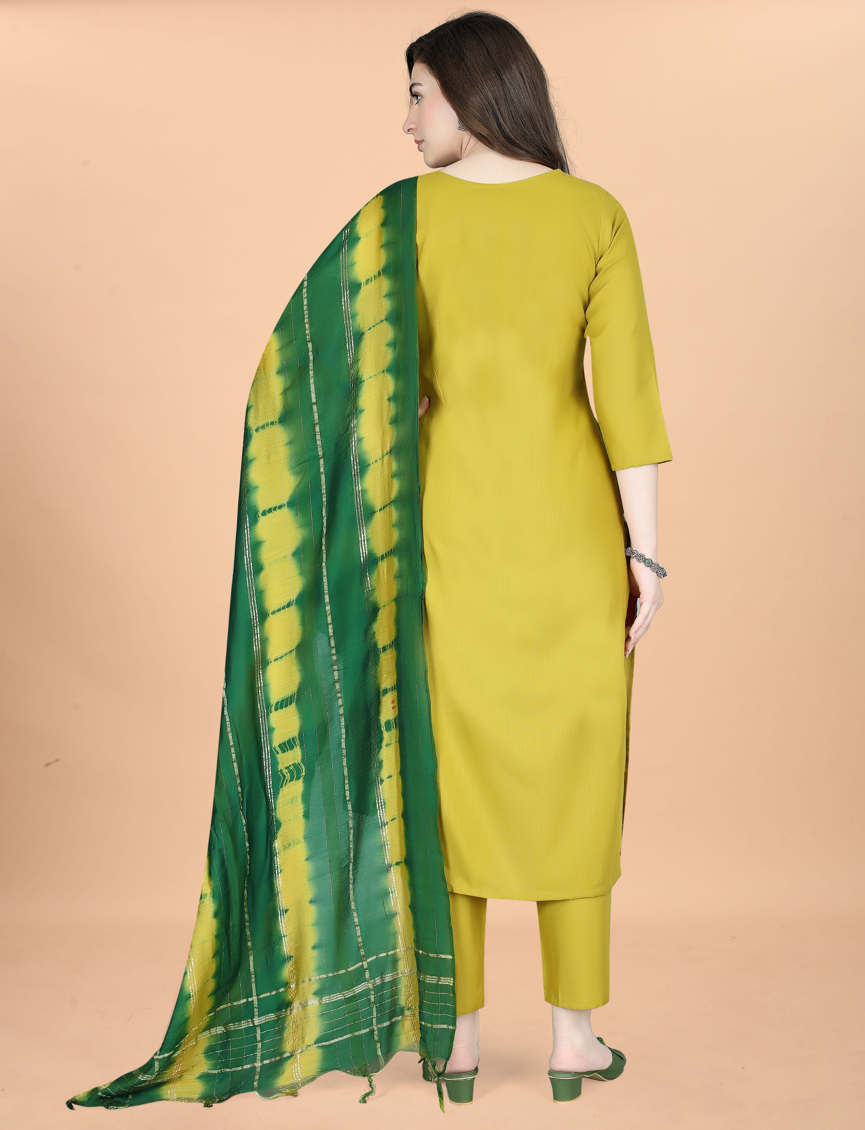 Back view of a woman wearing an olive green cotton blend kurta set with a green and yellow tie-dye Chanderi dupatta.