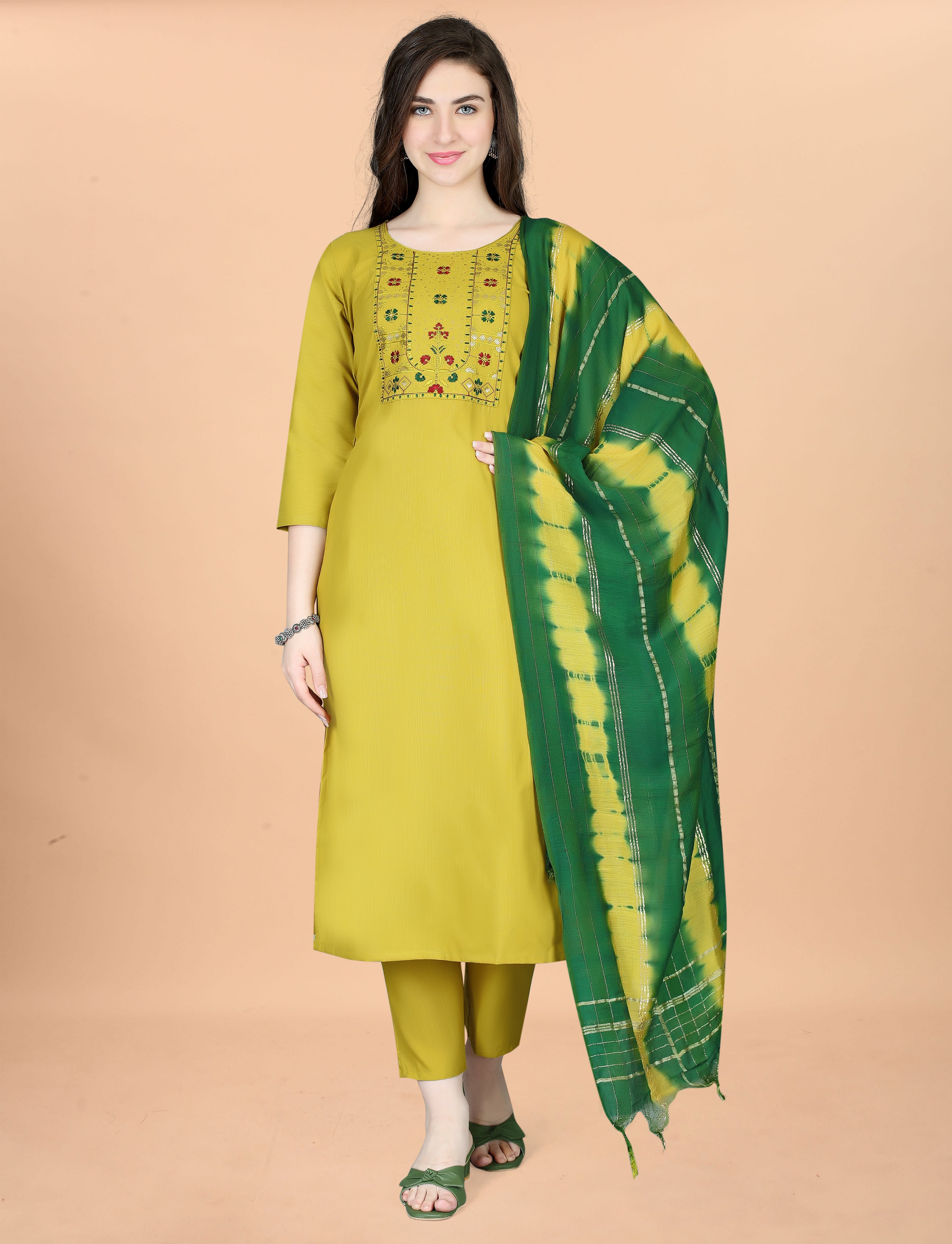 Full front view of a woman showcasing an olive green embroidered cotton blend kurta set with a matching tie-dye dupatta.