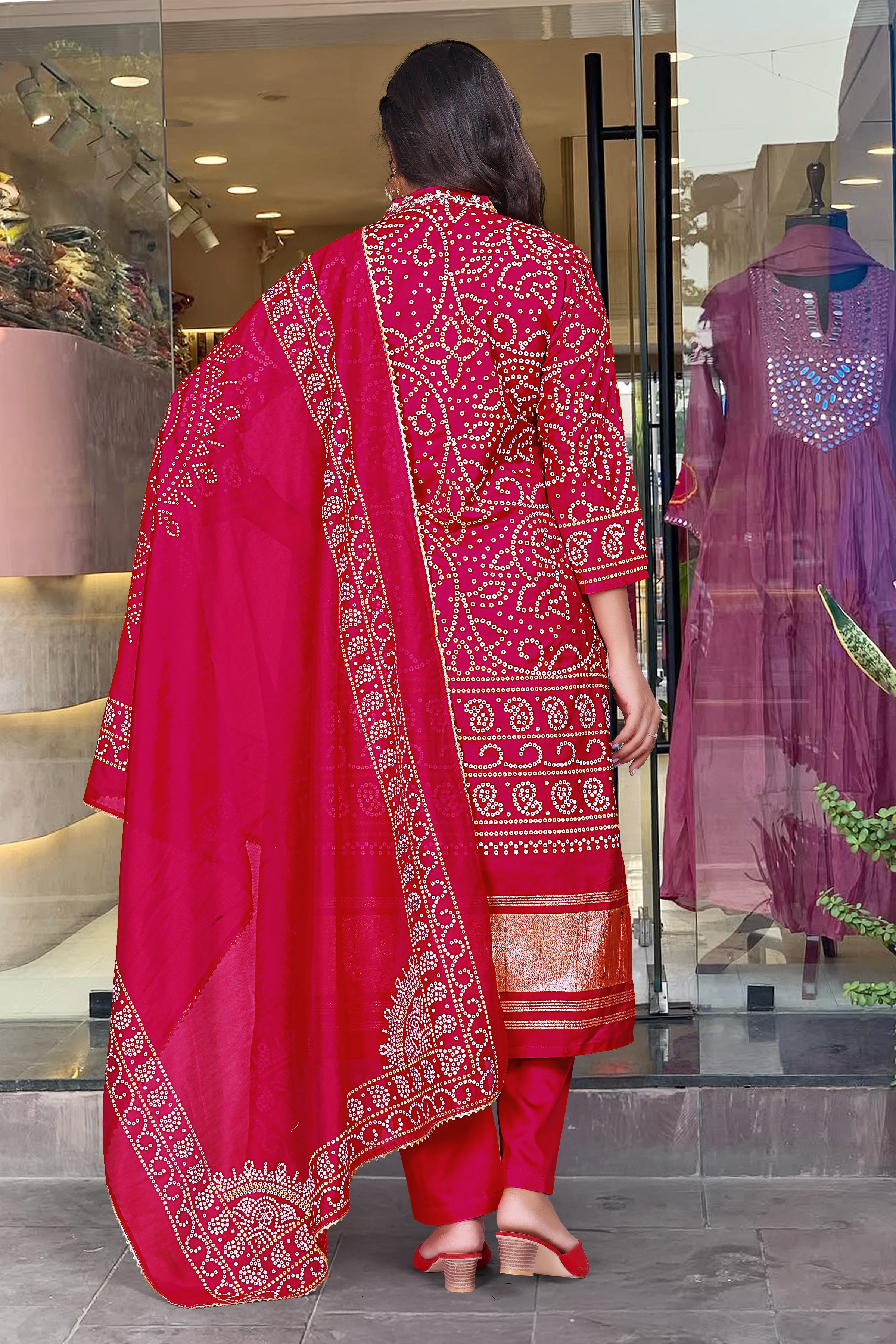 Full rear view of a woman in the complete magenta Kurti set, displaying the flowing Chanderi cotton dupatta with printed borders and the comfortable cotton pants.