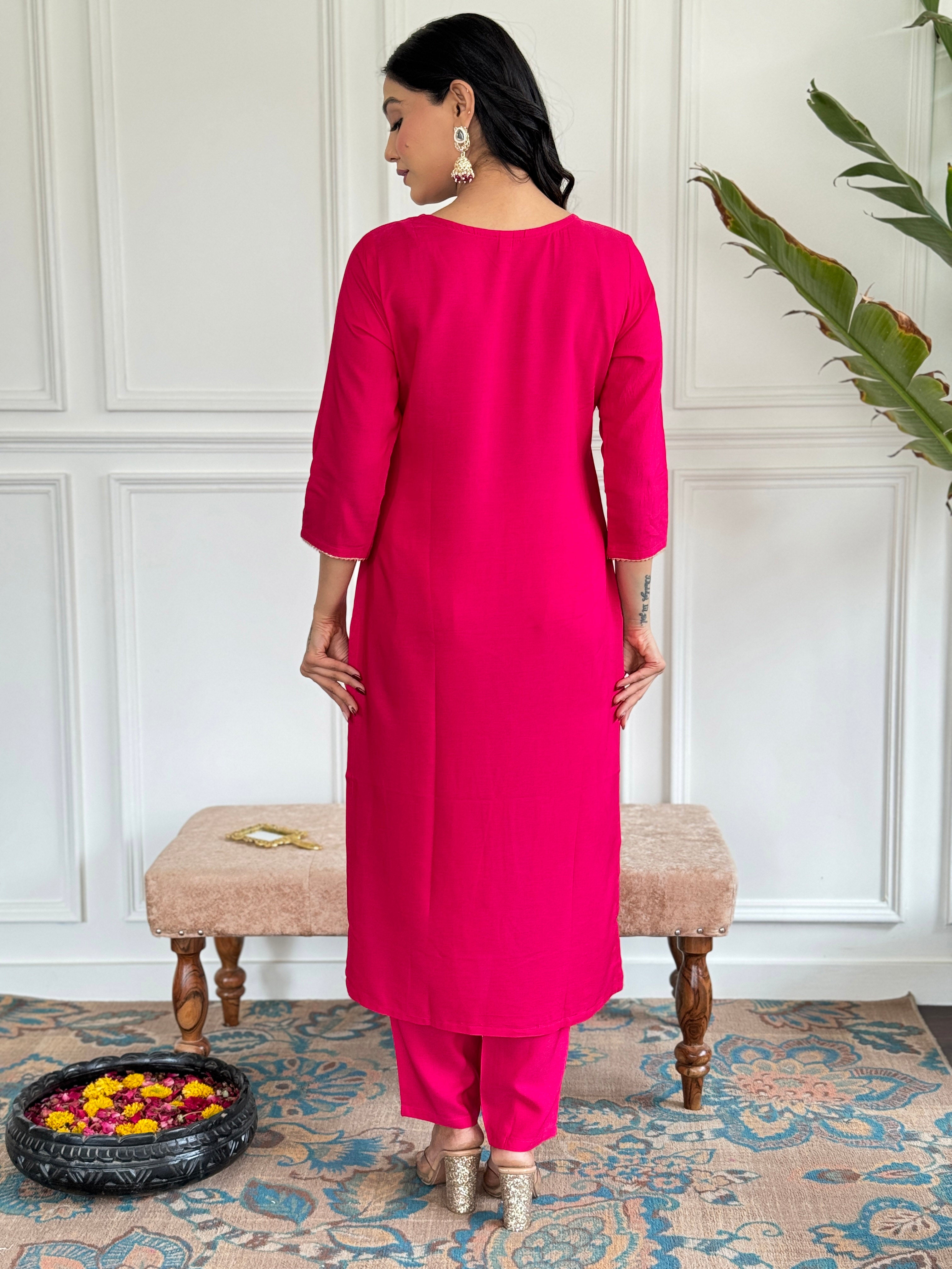 Back view of the model wearing the Gajri Viscose straight kurti and matching pants ensemble.