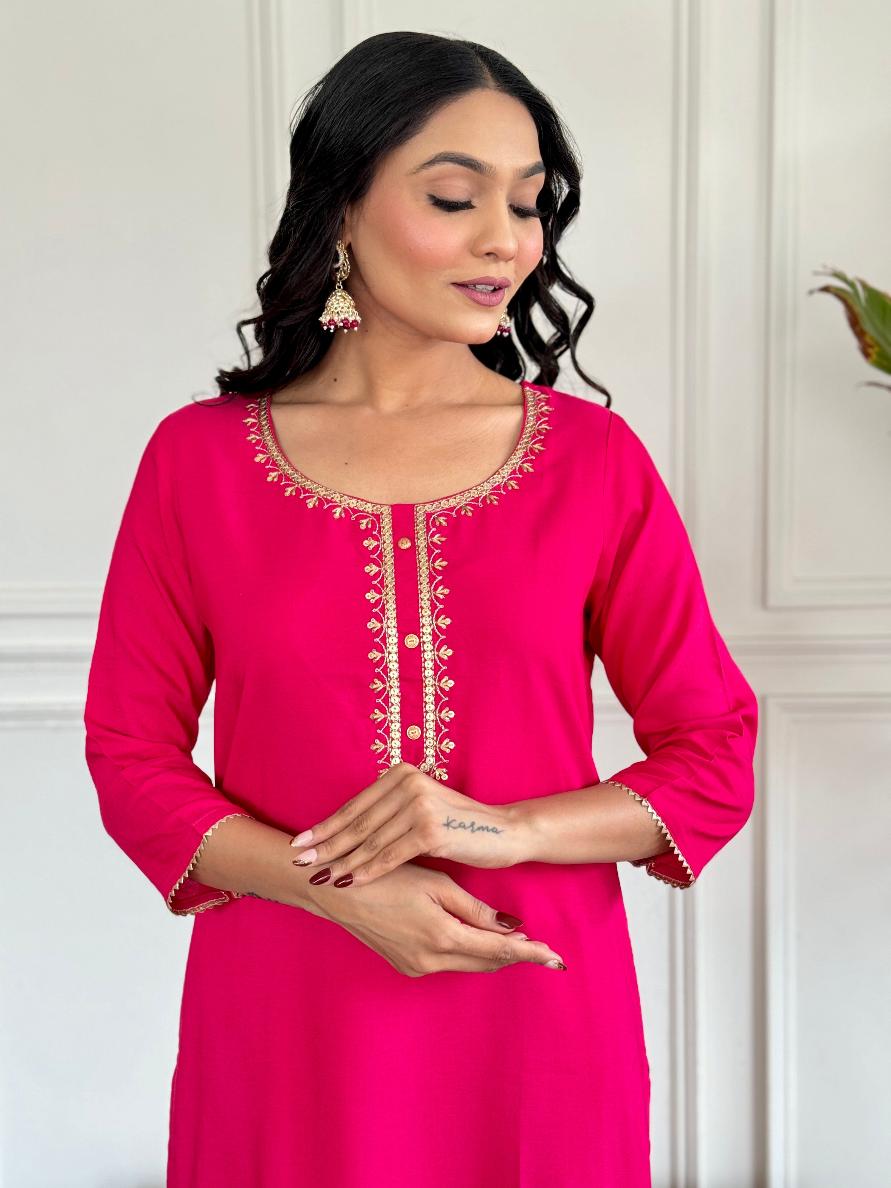 Detailed view of the model's face and the elegant neckline embroidery of the Gajri kurti, highlighting craftsmanship.