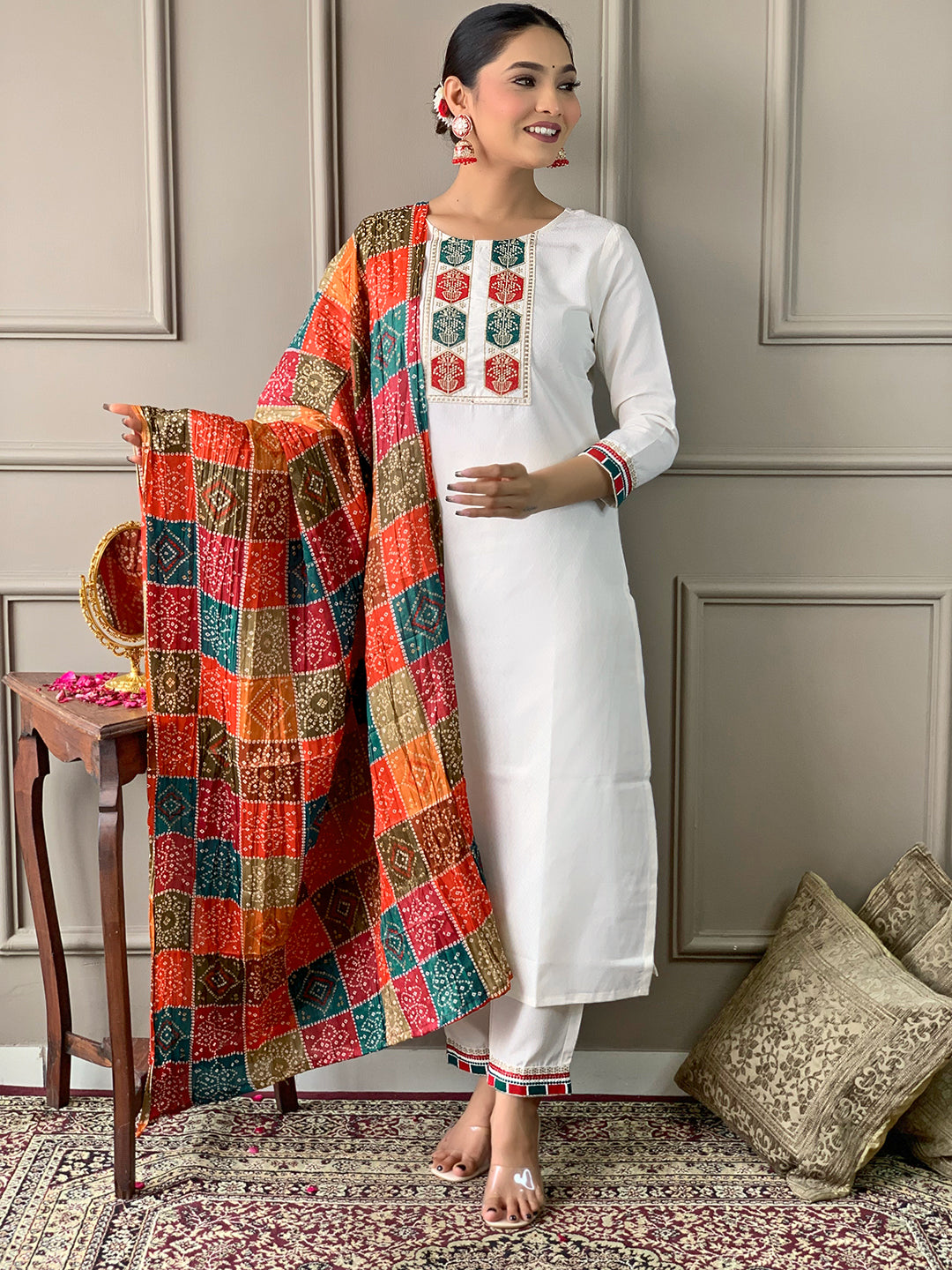 Model standing frontally in TRENDBUY D488 Off-White Kurta Set, holding the vibrant multi-color silk blend dupatta in front.