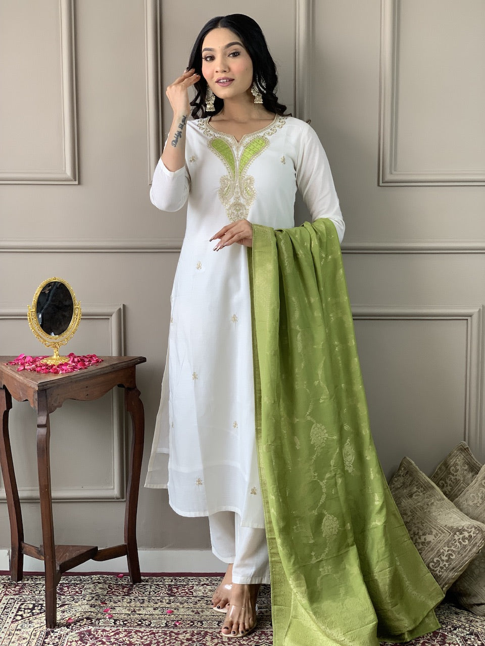 Model showcasing the TRENDBUY Off-White Viscose Kurta Set, highlighting the intricate embroidery and green dupatta.