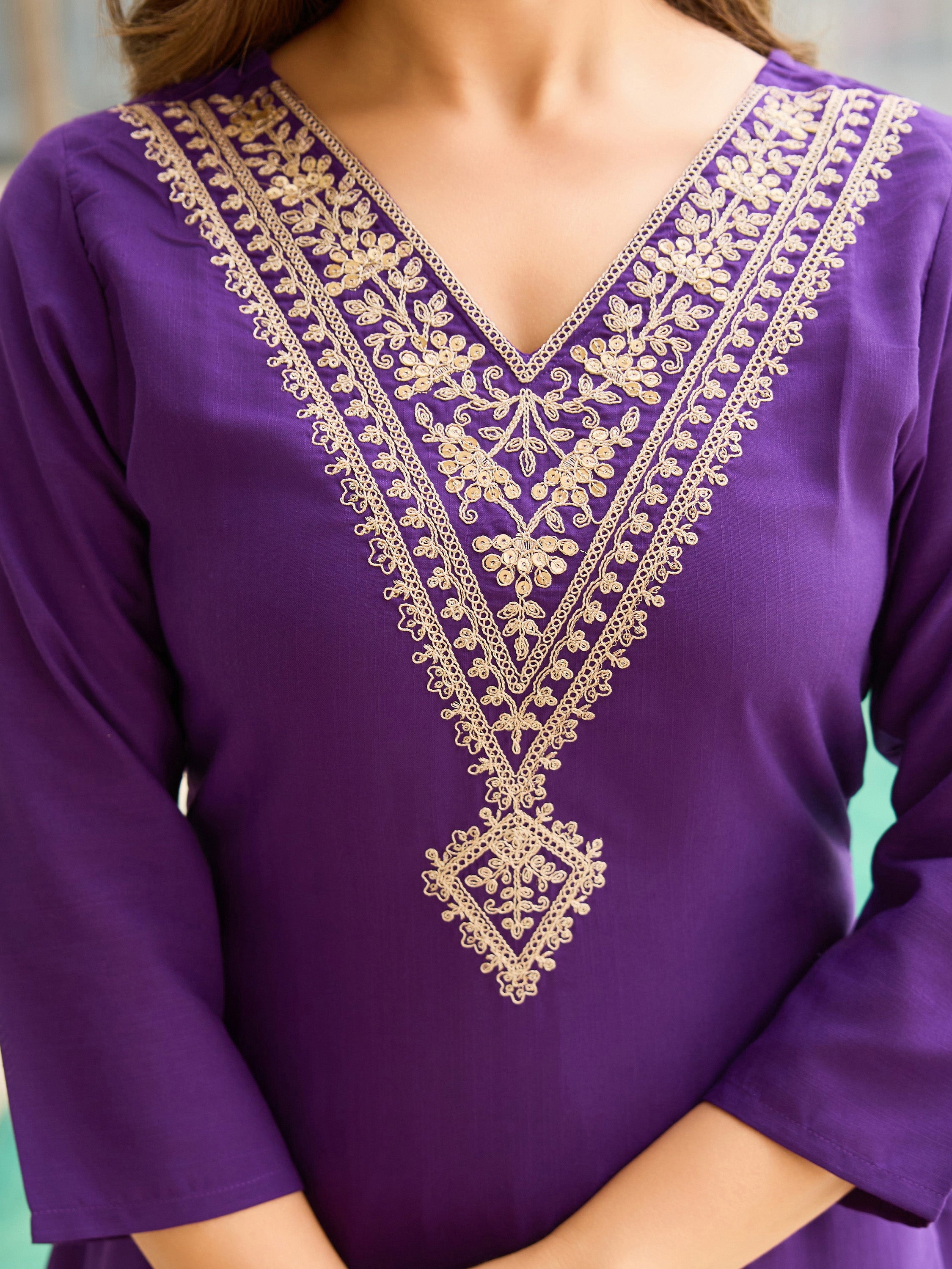 Close-up of intricate golden embroidery on the V-neck of a violet Rayon Slub kurti from TRENDBUY