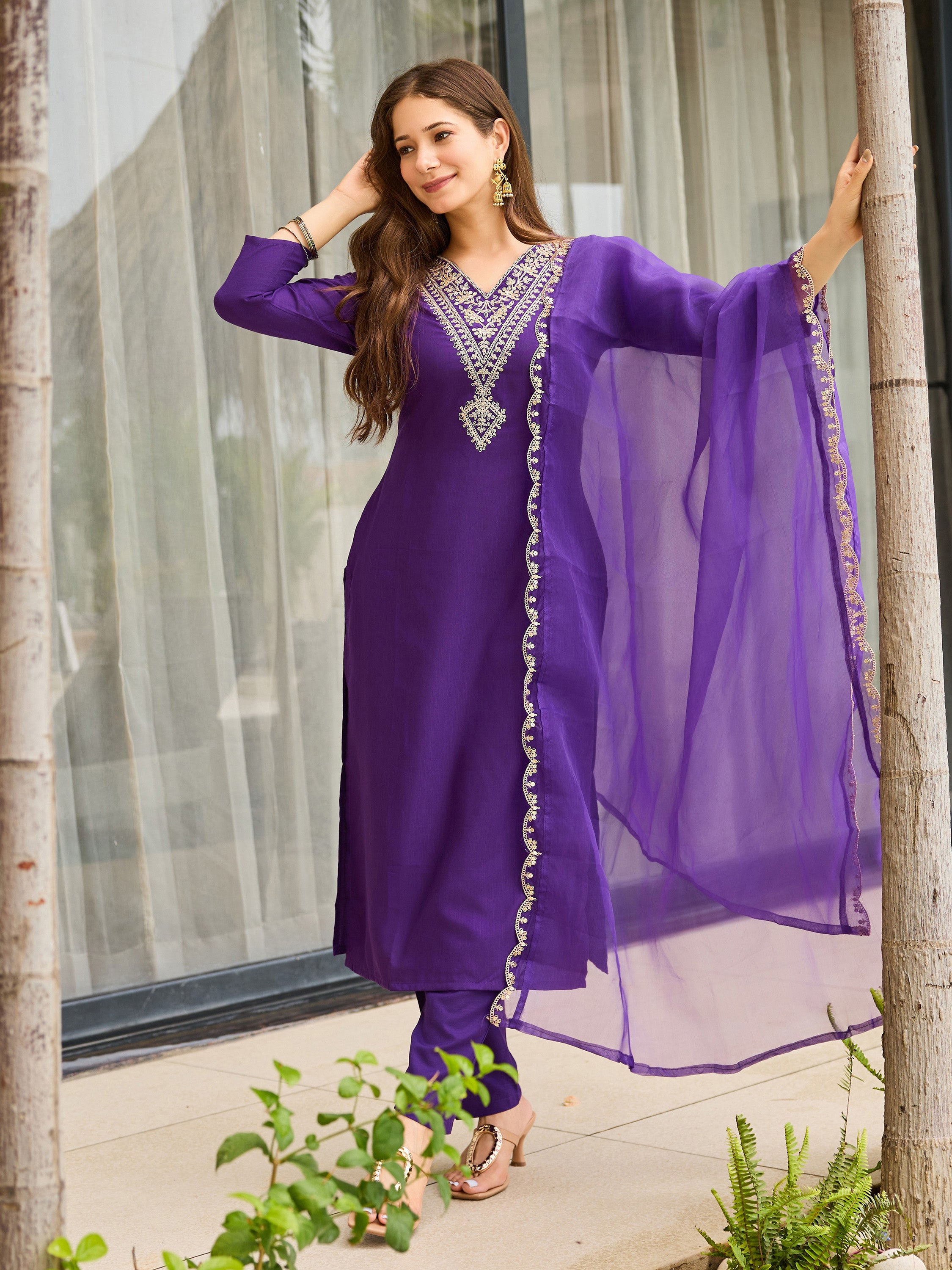 Side profile of TRENDBUY model in violet Rayon Slub kurti pant dupatta set, natural lighting